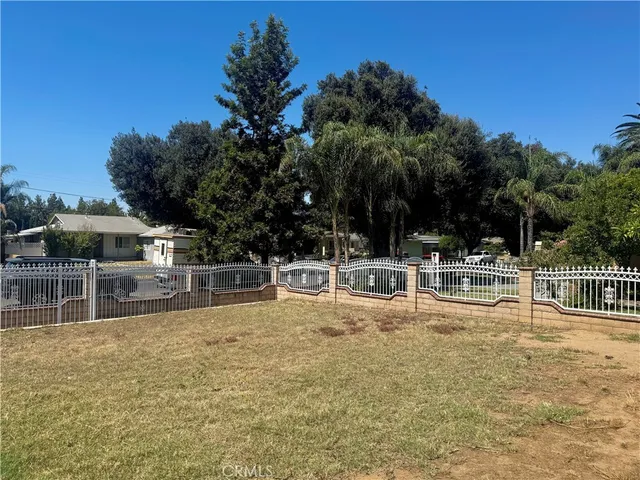 a view of a house with a iron gate