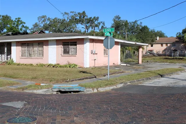 front view of house next to a yard
