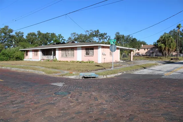 a house with a yard and large trees