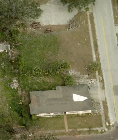a view of a balcony with floor to ceiling windows and wooden fence
