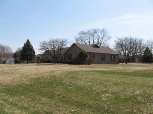 2907 Springbrook Road Crystal Lake, IL 60012 - Photo 1 of 1 a front view of house with yard and trees