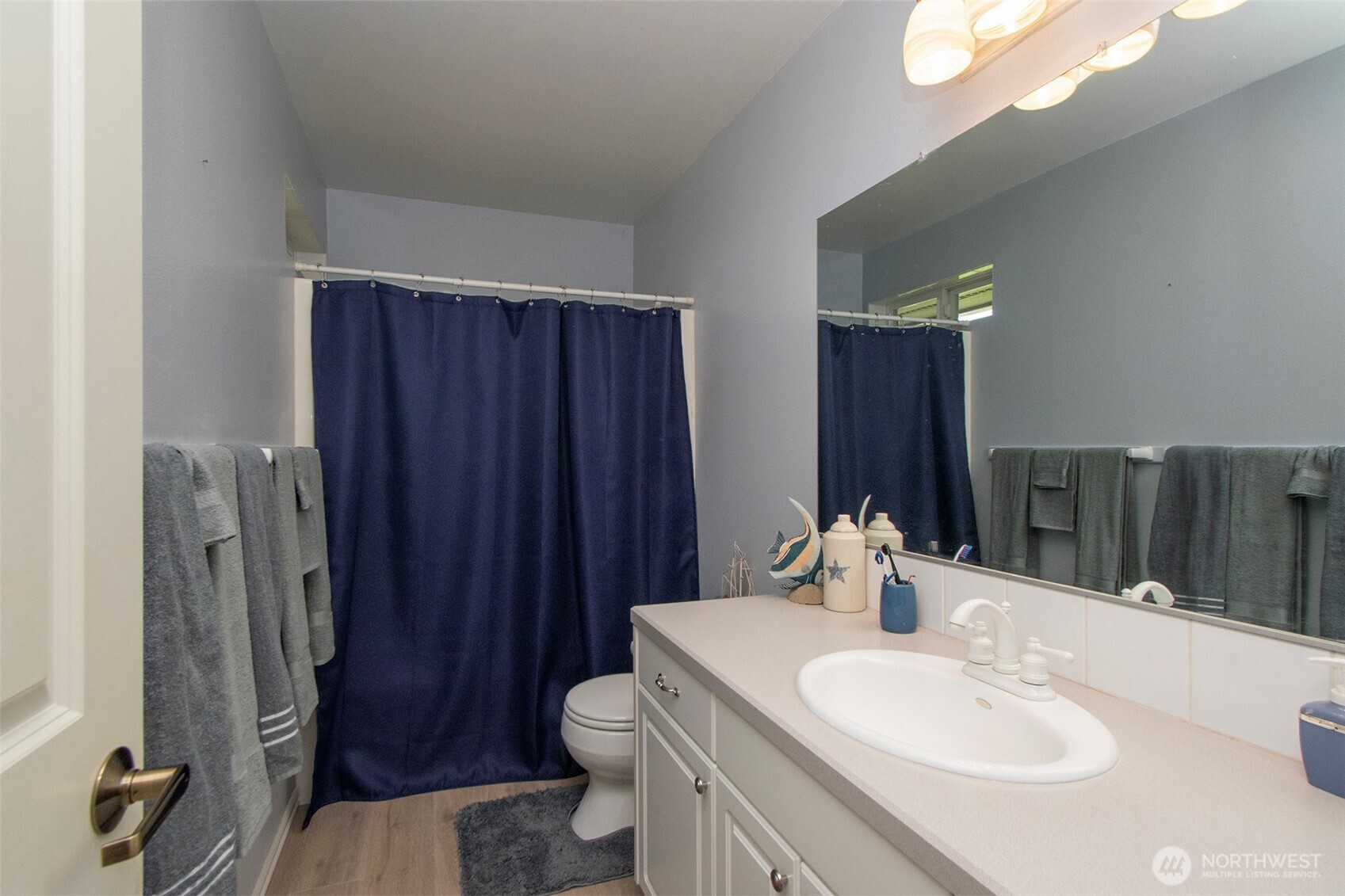 23 Pearl Place Sequim, WA 98382 - Photo 15 of 40 a bathroom with a sink vanity mirror and toilet