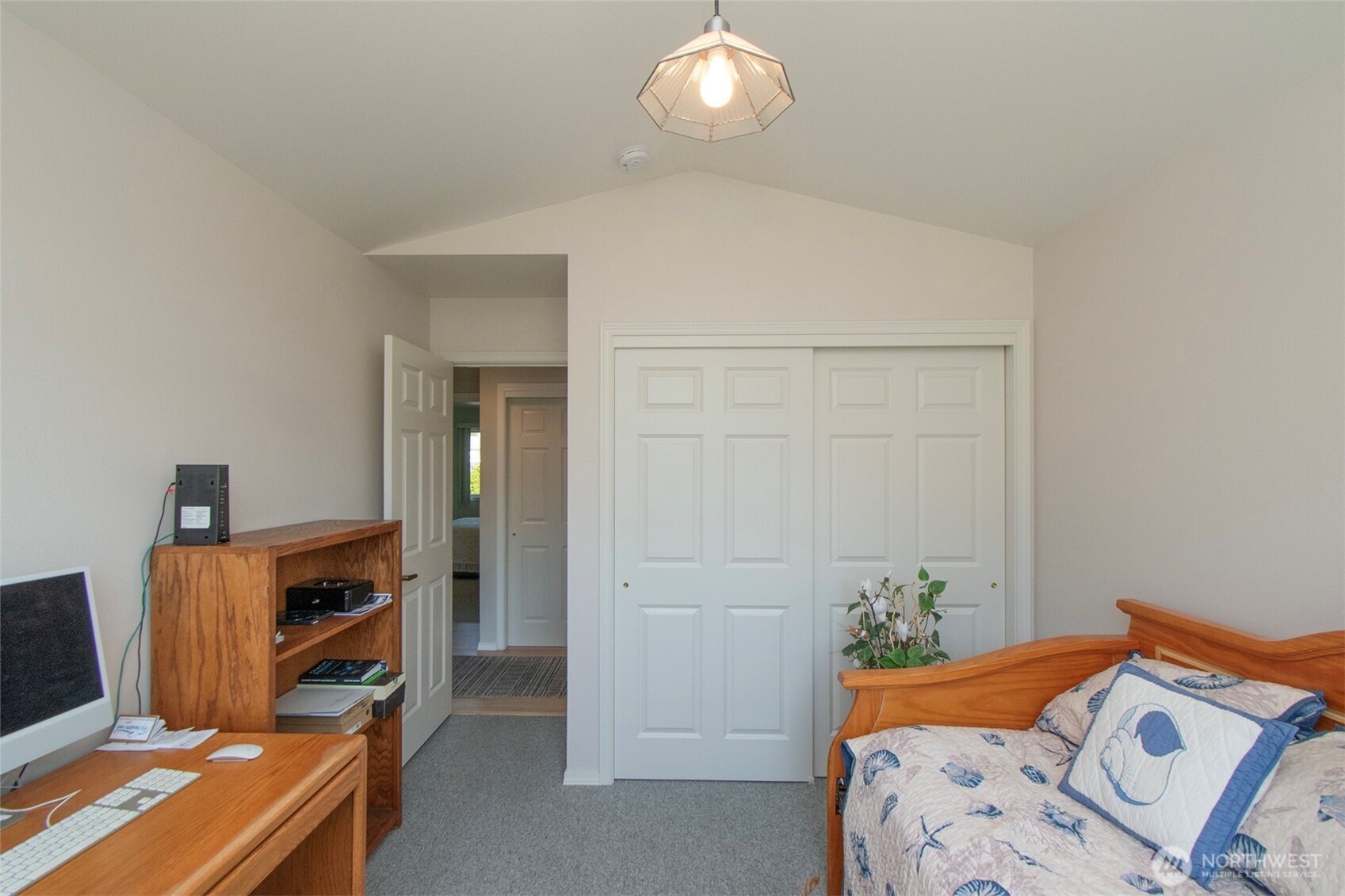 23 Pearl Place Sequim, WA 98382 - Photo 17 of 40 a bedroom with bed and a workspace