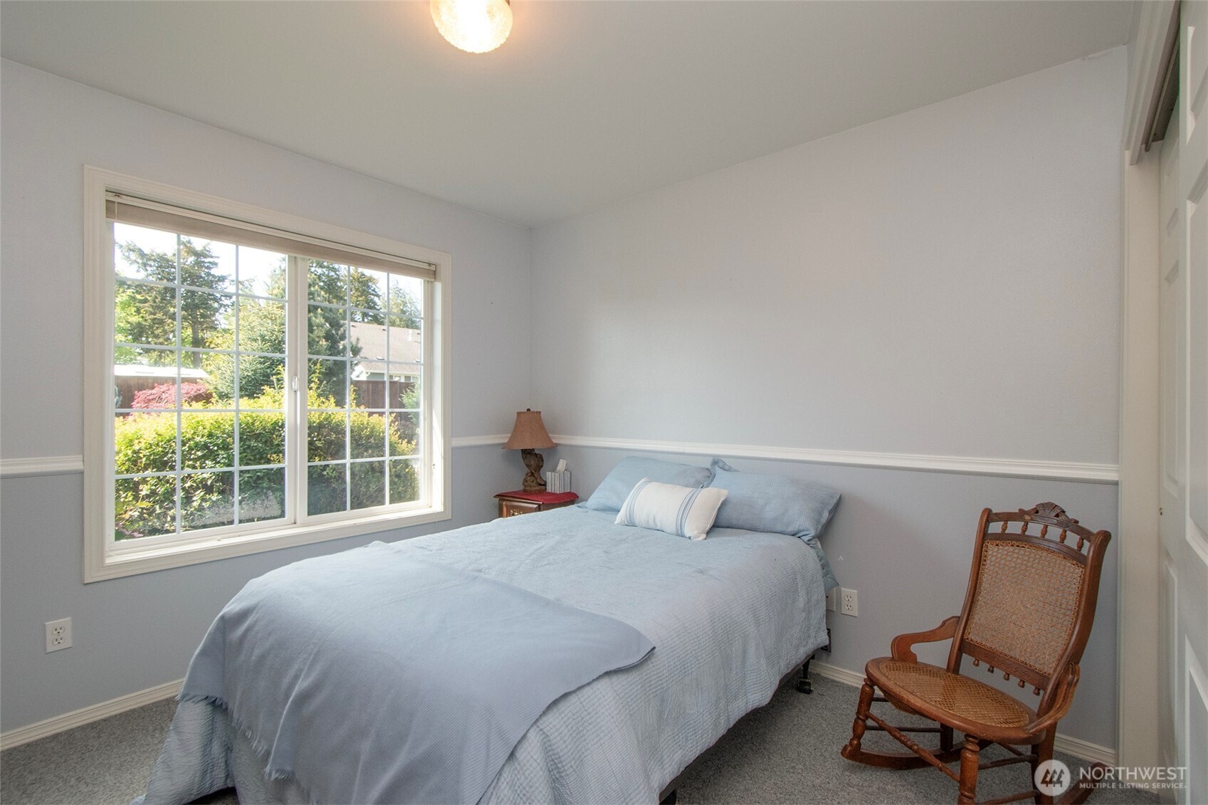 23 Pearl Place Sequim, WA 98382 - Photo 18 of 40 a bedroom with a bed chair and window