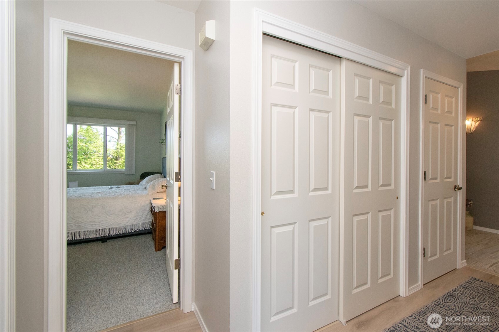 23 Pearl Place Sequim, WA 98382 - Photo 19 of 40 a view of a bedroom from a hallway