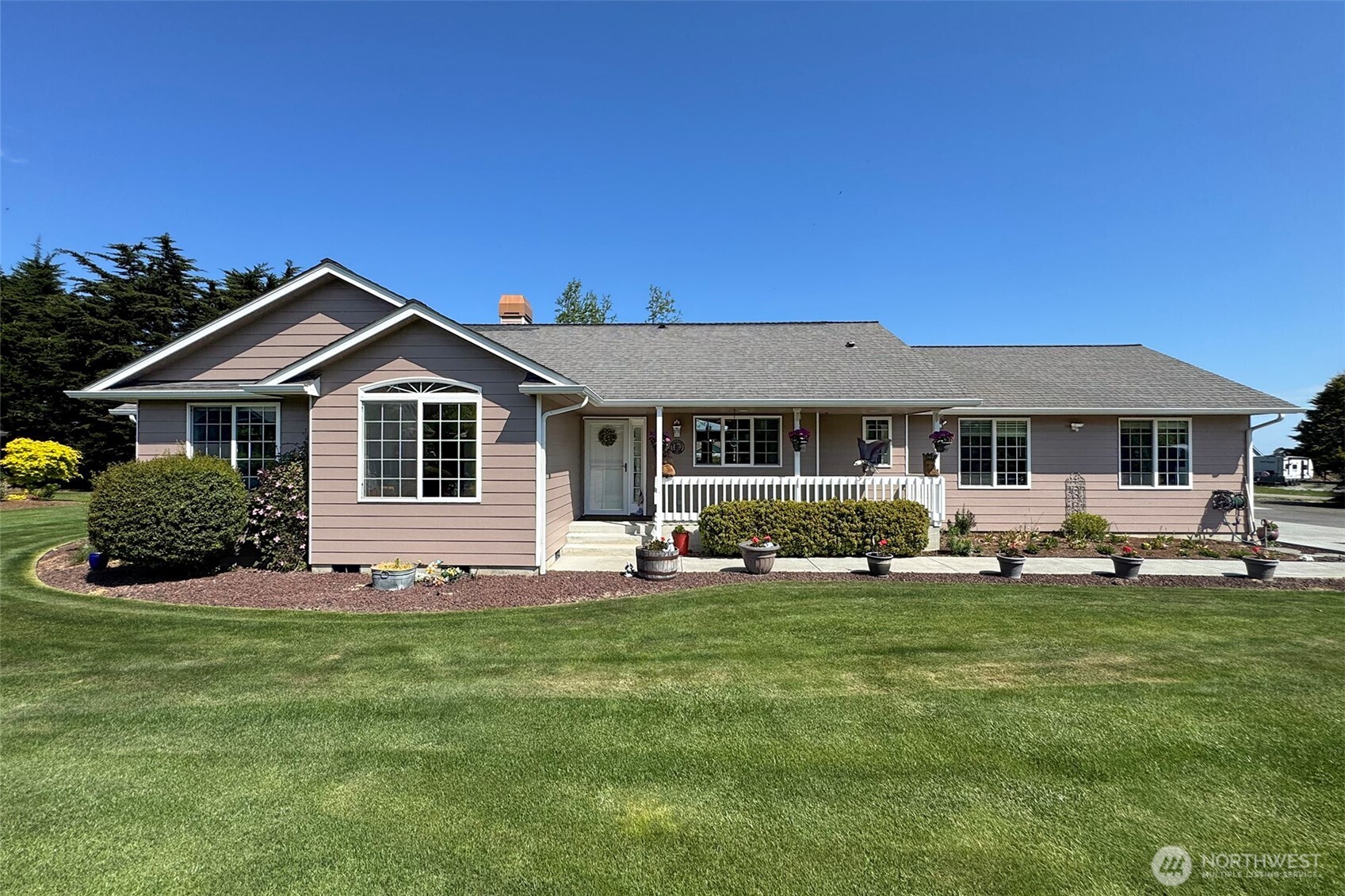 23 Pearl Place Sequim, WA 98382 - Photo 2 of 40 a front view of a house with a yard