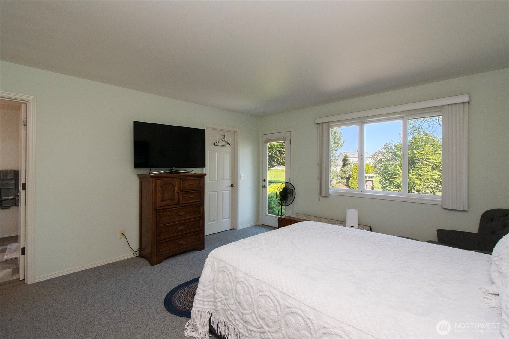 23 Pearl Place Sequim, WA 98382 - Photo 21 of 40 a bedroom with a bed and a flat screen tv
