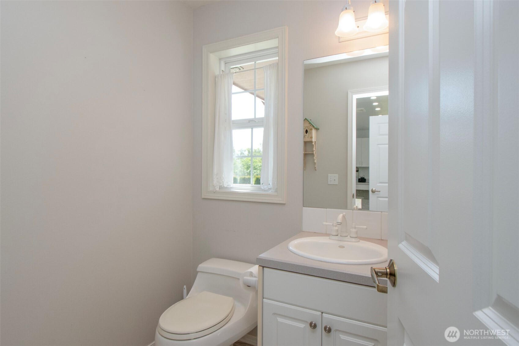 23 Pearl Place Sequim, WA 98382 - Photo 23 of 40 a bathroom with a toilet sink and mirror