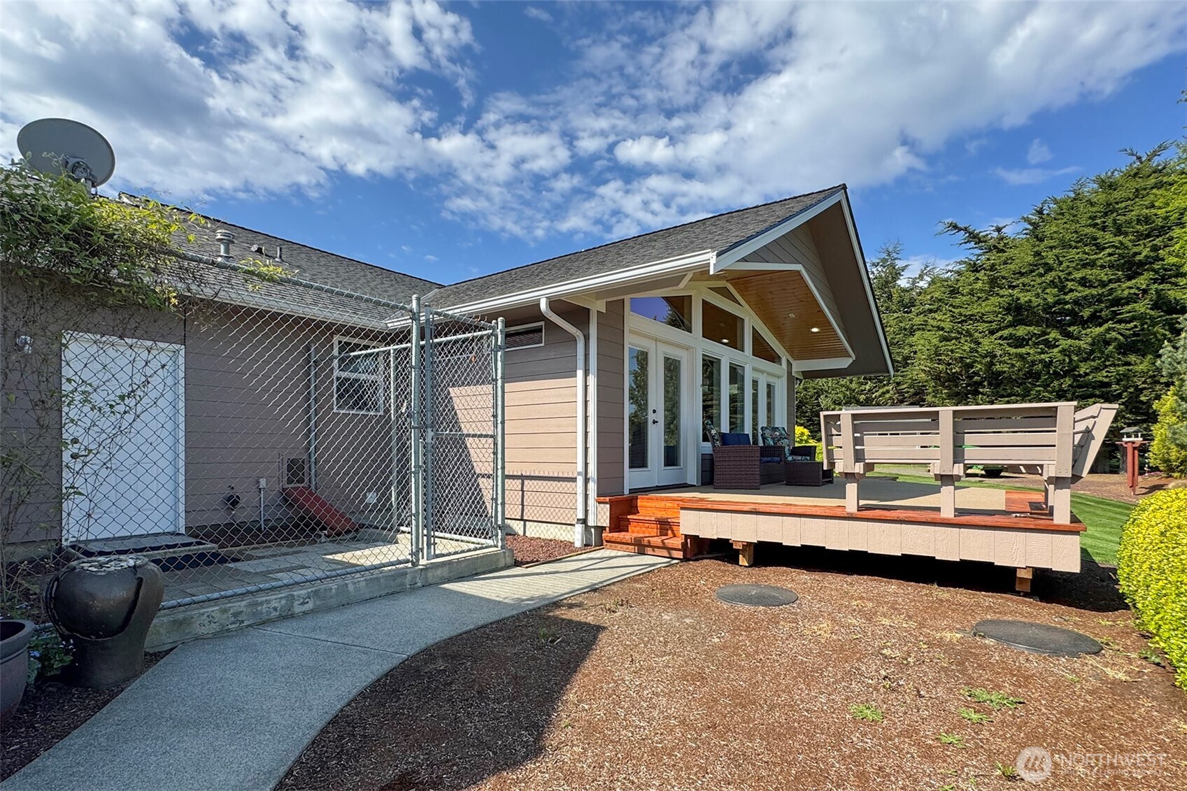 23 Pearl Place Sequim, WA 98382 - Photo 25 of 40 a backyard of a house with basket ball court and outdoor seating