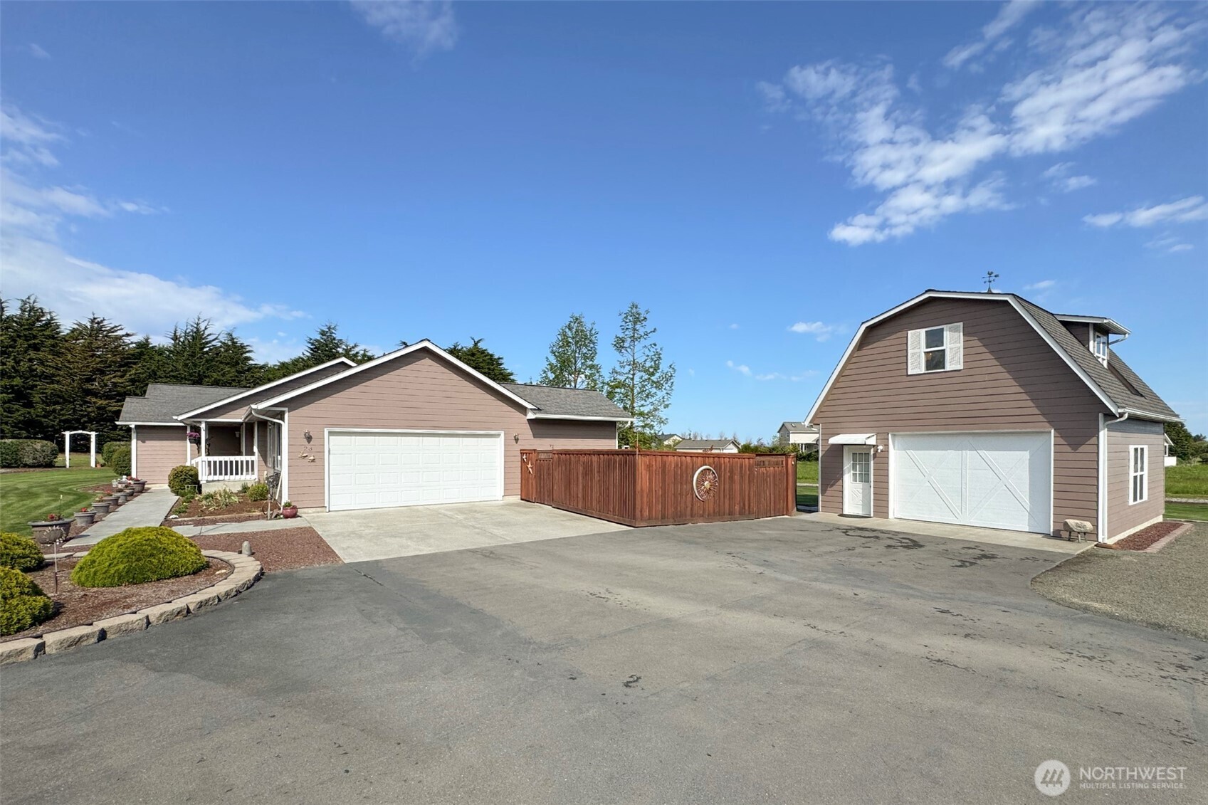 23 Pearl Place Sequim, WA 98382 - Photo 28 of 40 a view of a house with a yard and garage