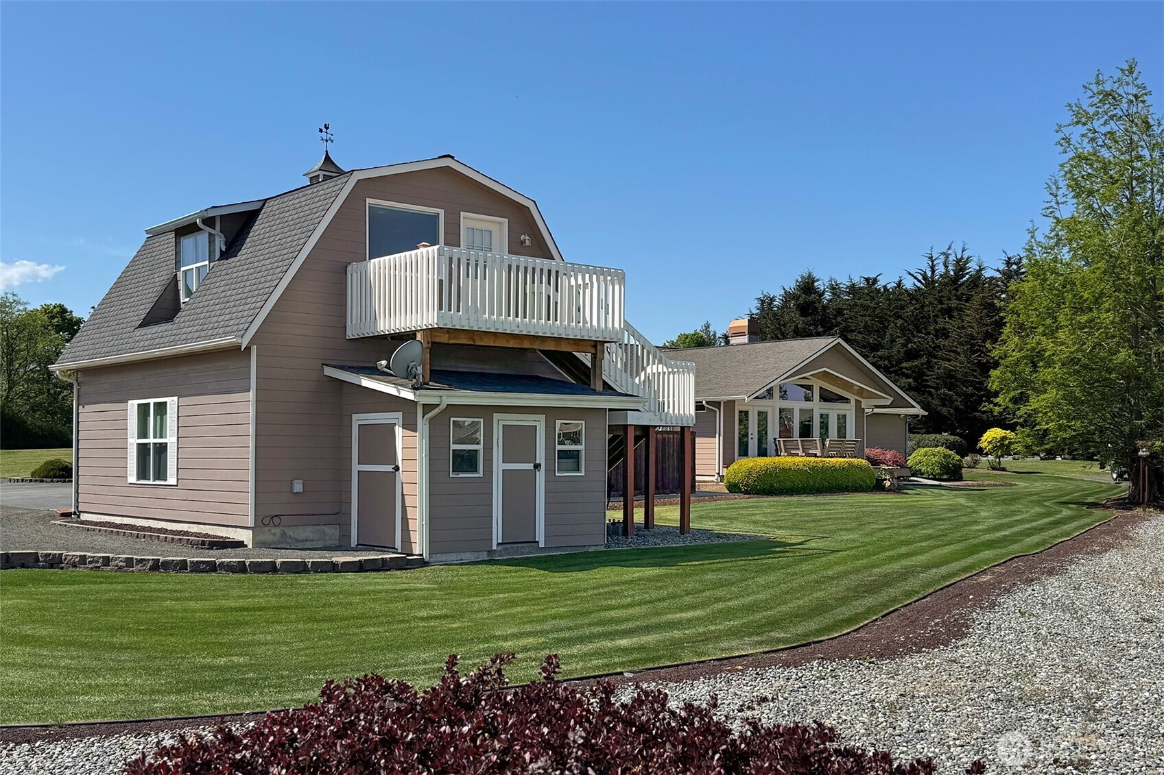 23 Pearl Place Sequim, WA 98382 - Photo 31 of 40 a front view of a house with a garden