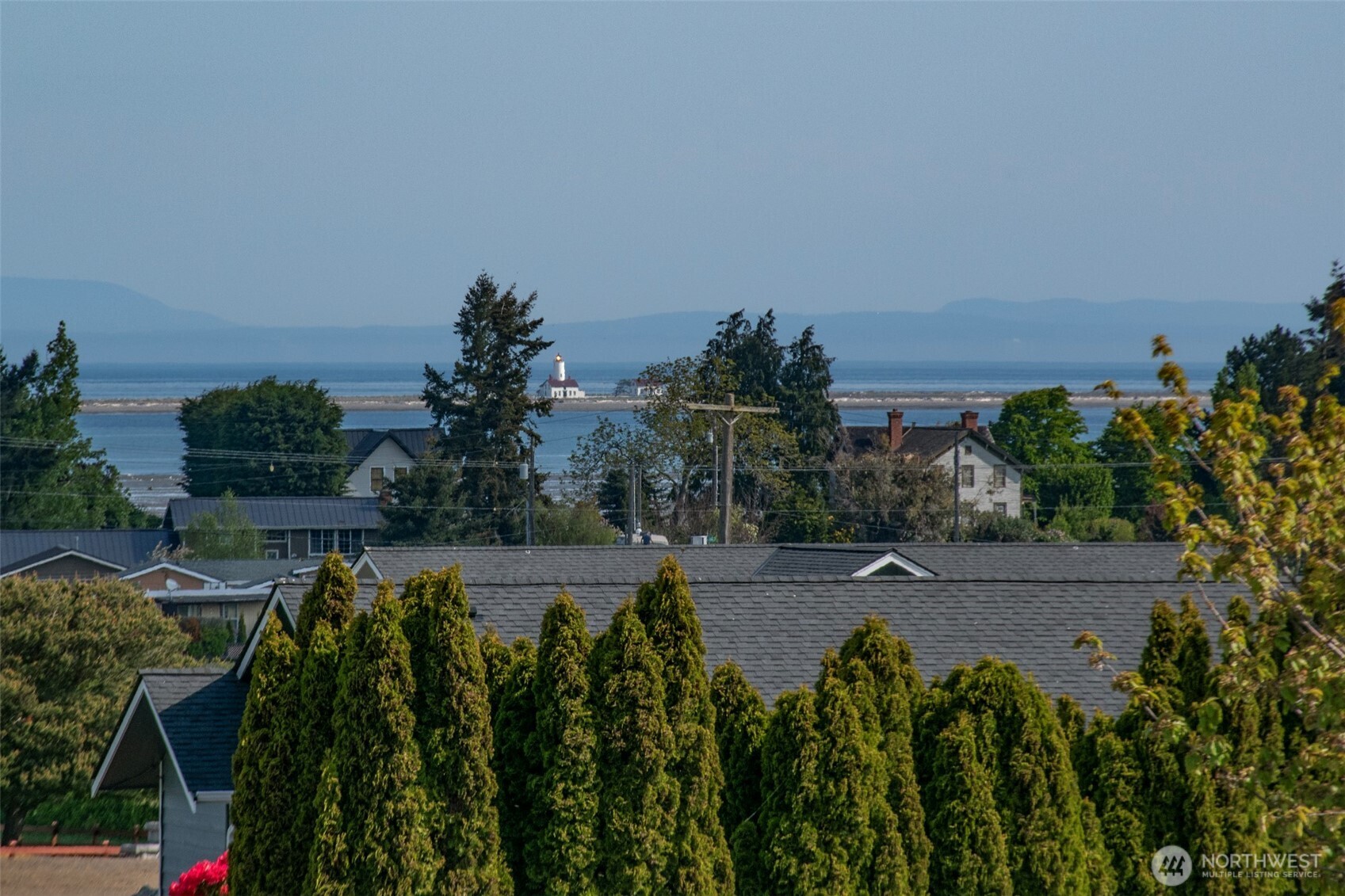 23 Pearl Place Sequim, WA 98382 - Photo 33 of 40 a view of a yard with plants and a building