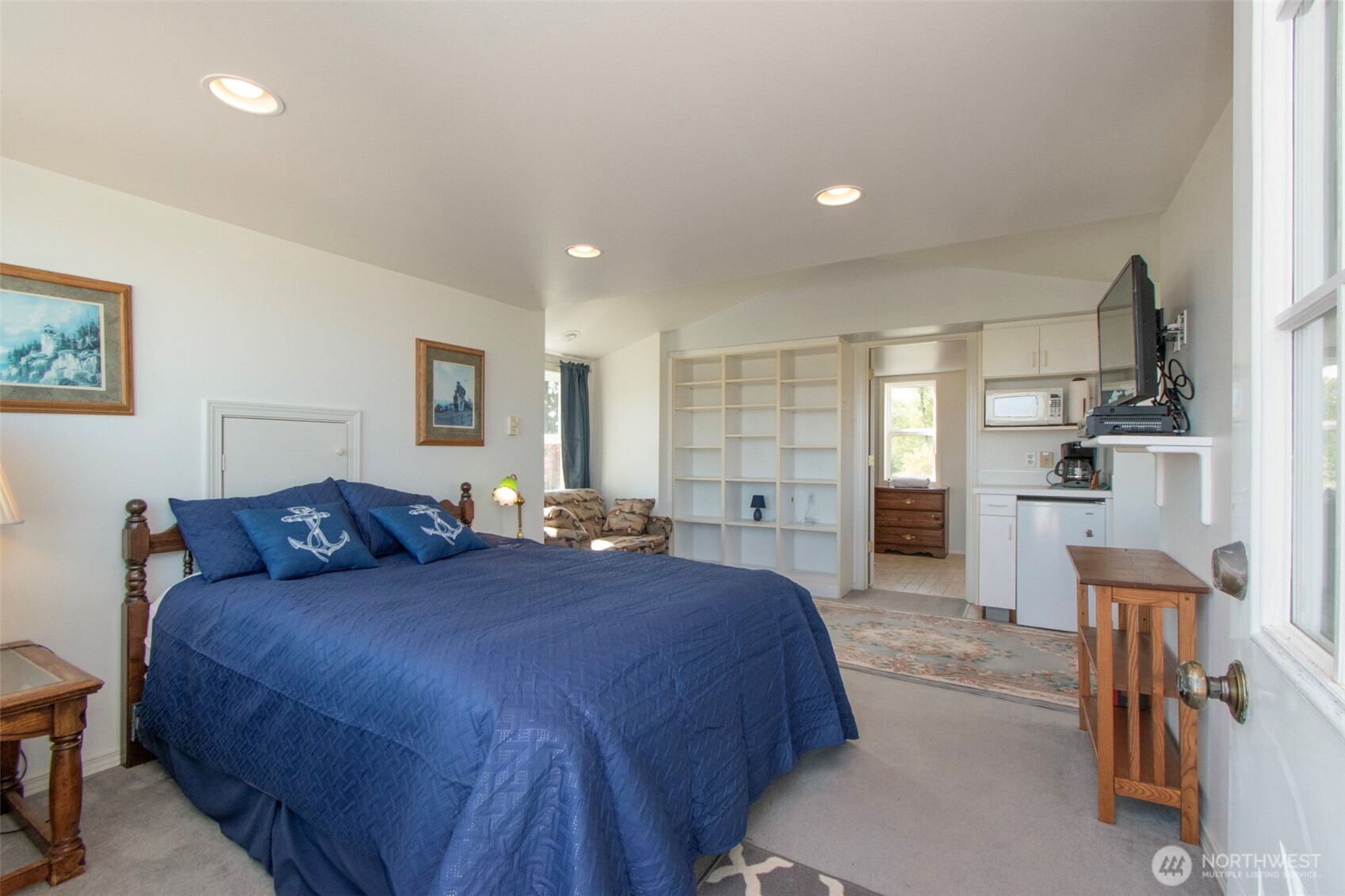 23 Pearl Place Sequim, WA 98382 - Photo 34 of 40 a spacious bedroom with a bed and a view of kitchen