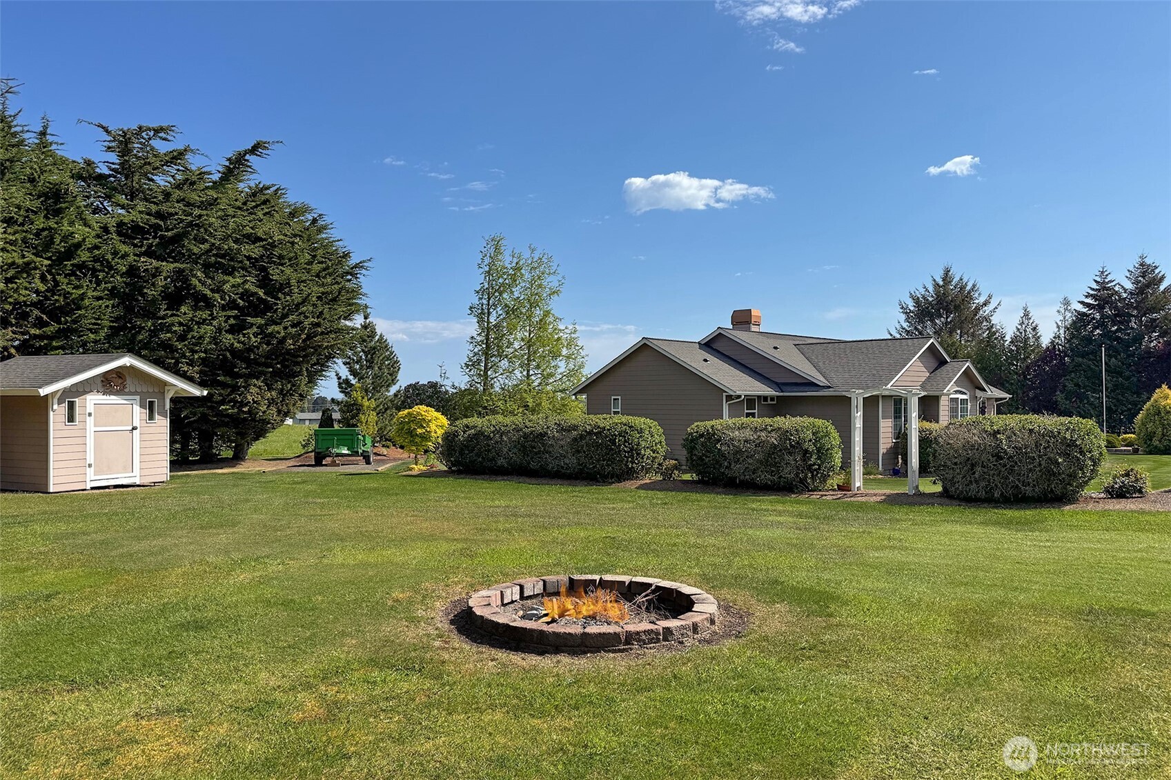 23 Pearl Place Sequim, WA 98382 - Photo 39 of 40 a front view of a house with a garden and plants