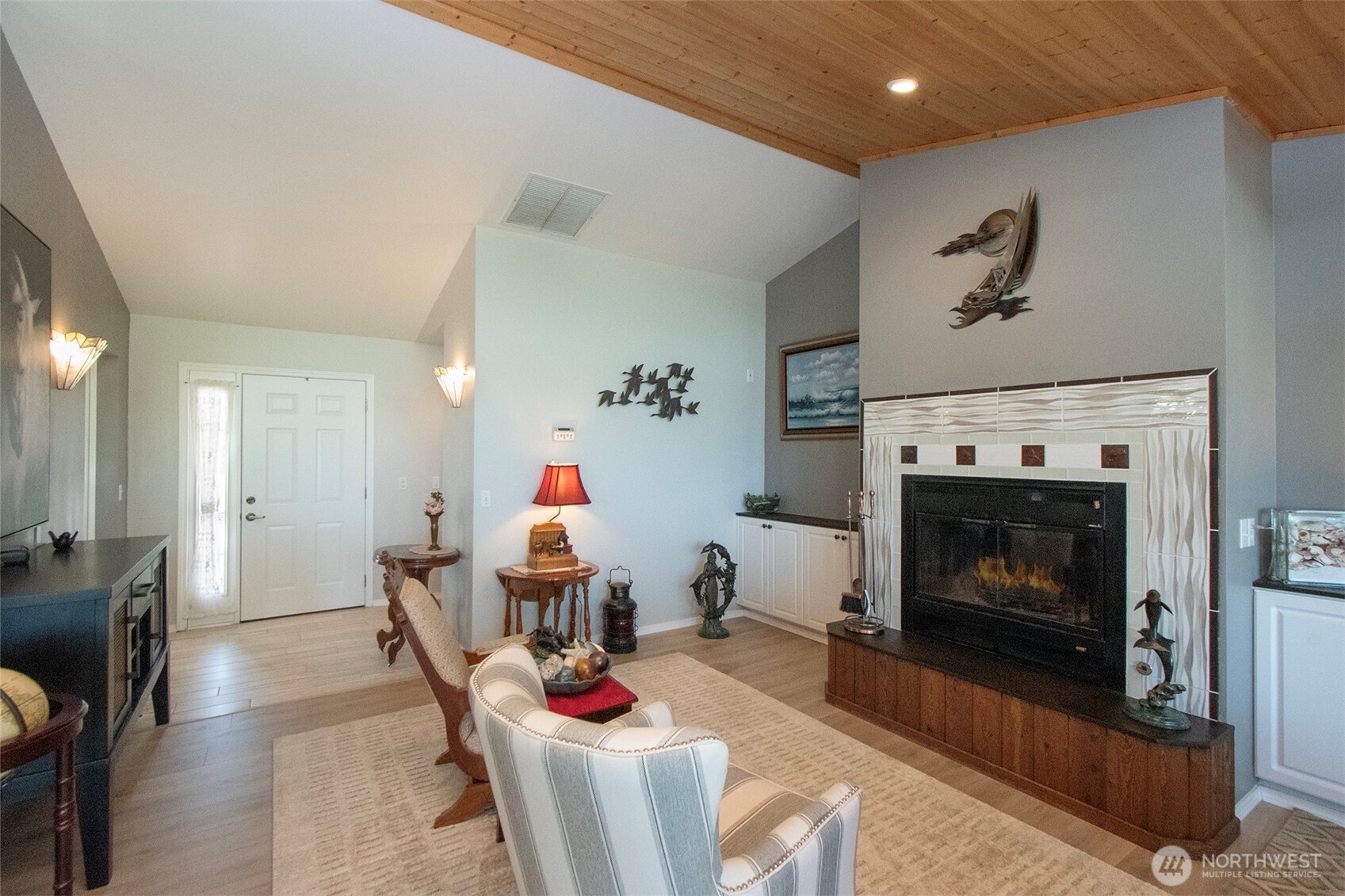 23 Pearl Place Sequim, WA 98382 - Photo 4 of 40 a living room with furniture and a fireplace