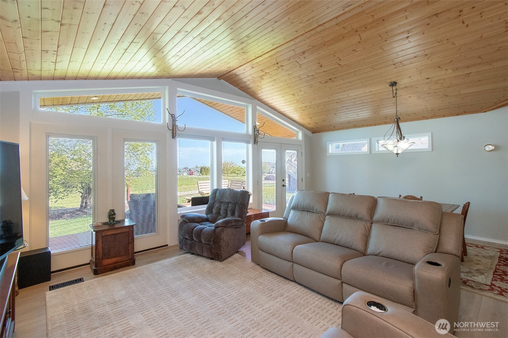 23 Pearl Place Sequim, WA 98382 - Photo 6 of 40 a living room with furniture and a floor to ceiling window