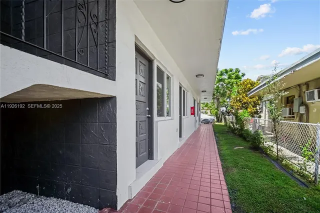 a view of a pathway both side of house