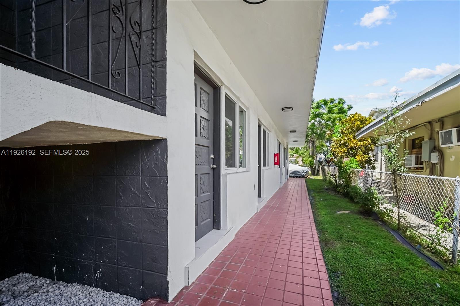 2622 Northwest 24th Street, Unit 3 Miami, FL 33142 - Photo 18 of 21 a view of a pathway both side of house