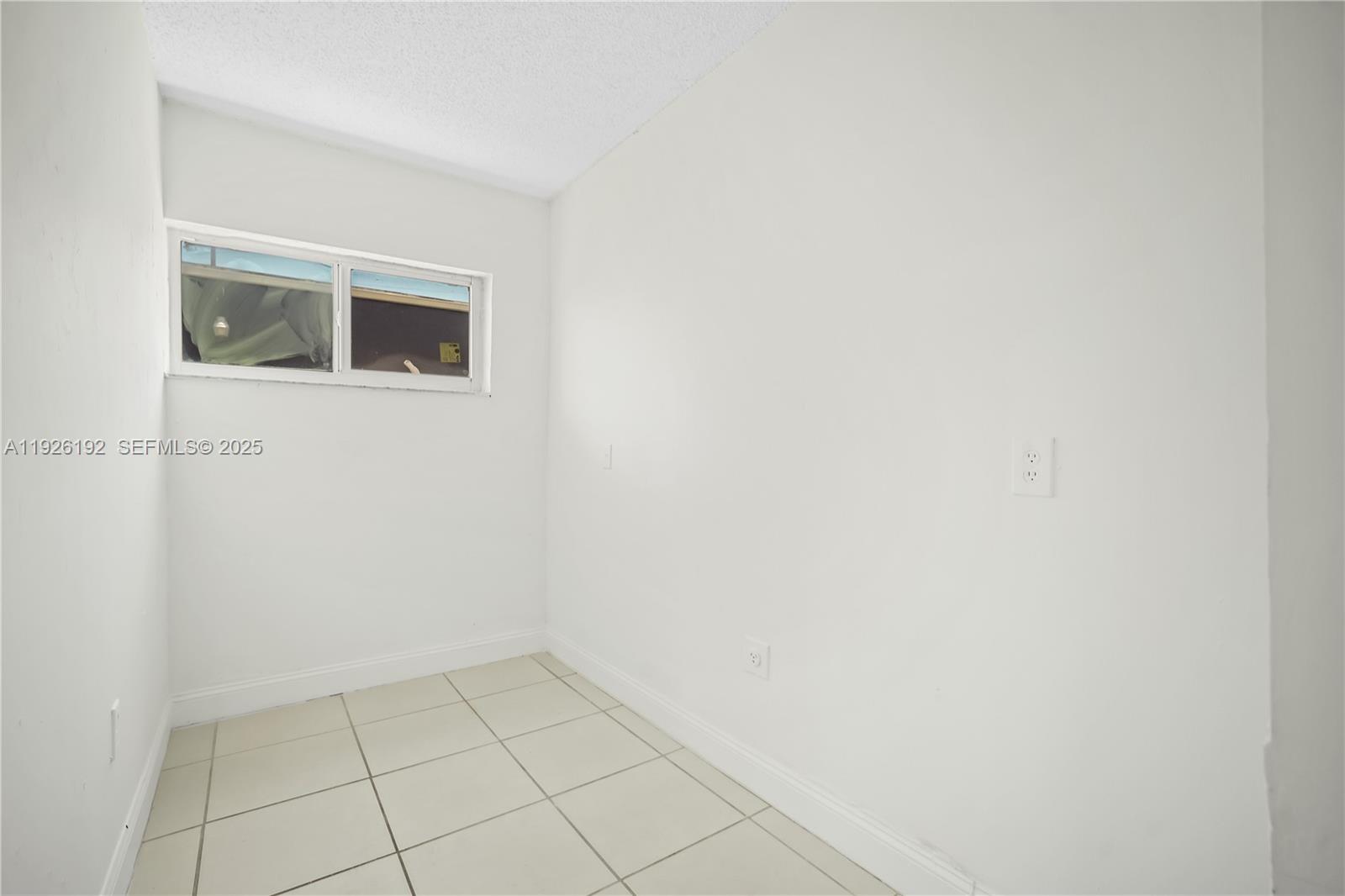 2622 Northwest 24th Street, Unit 3 Miami, FL 33142 - Photo 3 of 21 a view of an empty room