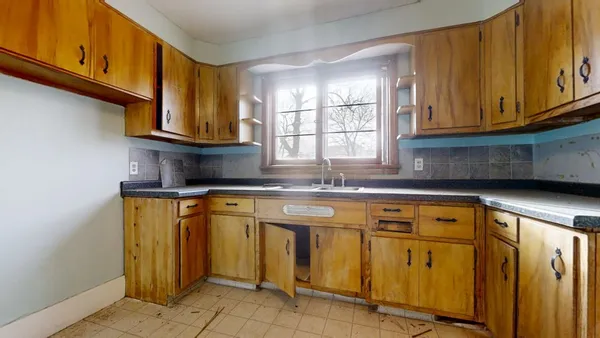 a kitchen with stainless steel appliances granite countertop a sink and cabinets