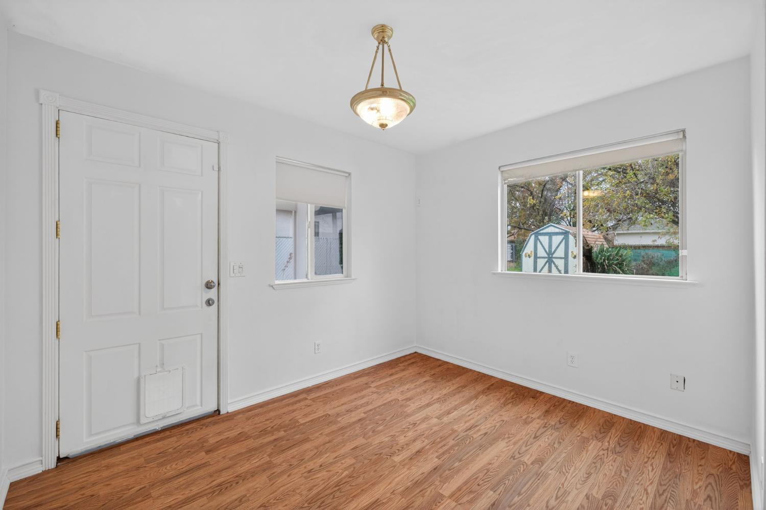 2812 Plover Street Sacramento, CA 95815 - Photo 24 of 40 a view of empty room with wooden floor and fan