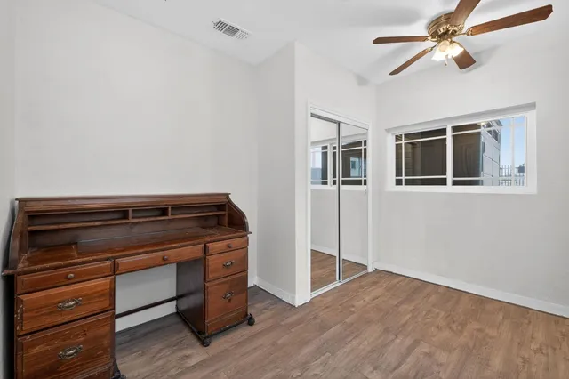 a view of room with wooden floor