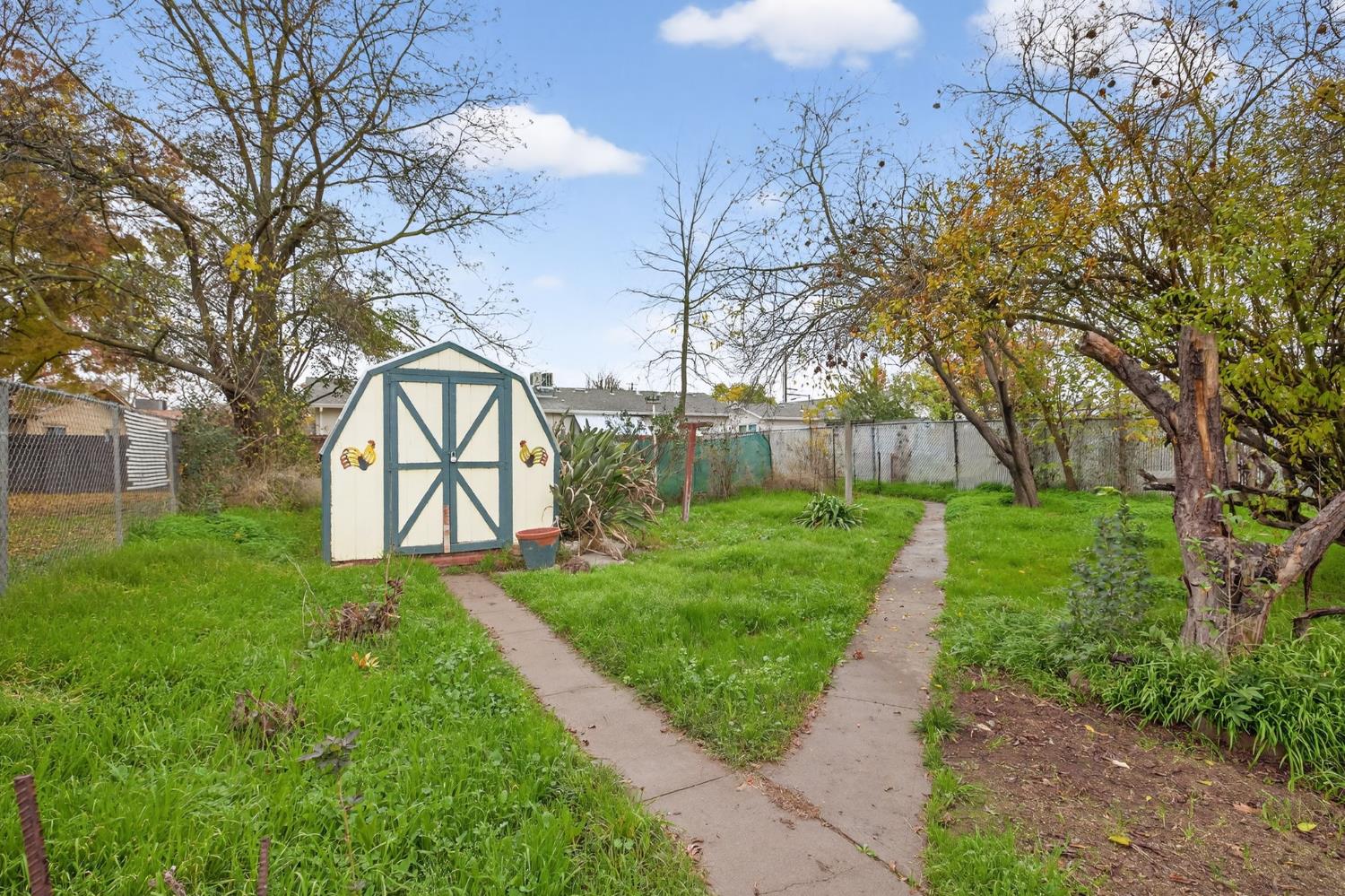 2812 Plover Street Sacramento, CA 95815 - Photo 32 of 40 a view of a yard with large trees