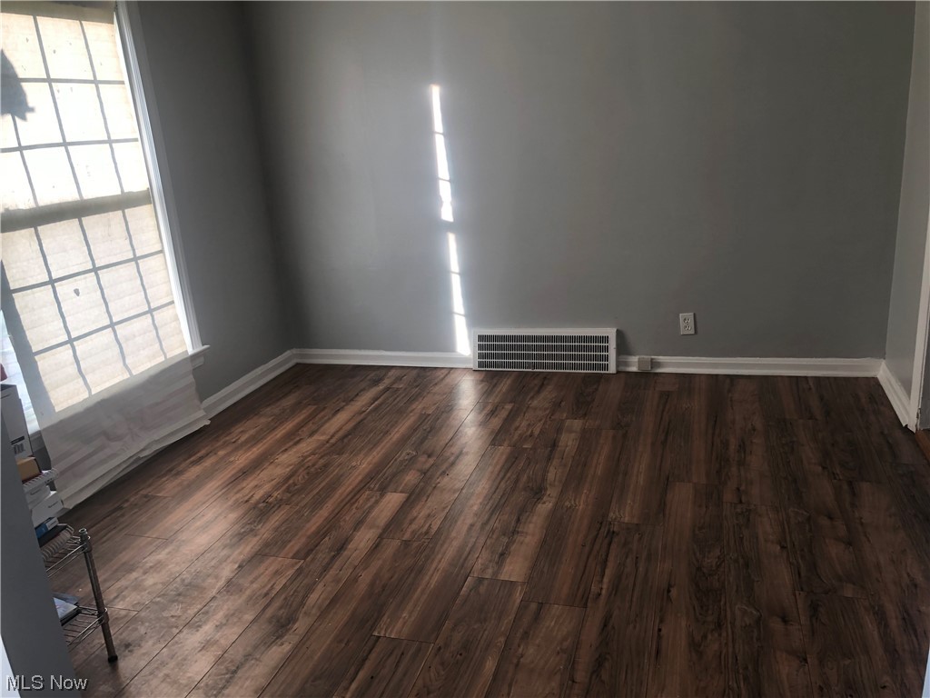 13623 Thraves Road Garfield Heights, OH 44125 - Photo 23 of 23 Empty room featuring dark hardwood / wood-style flooring