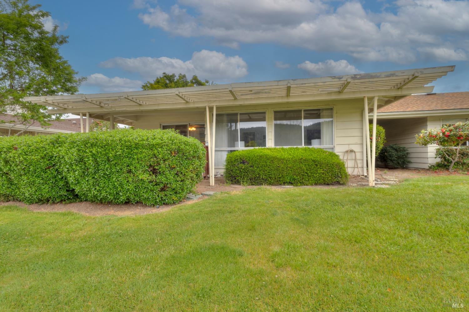 a front view of a house with garden
