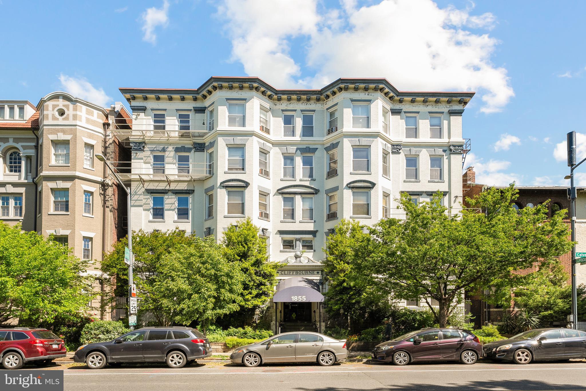 1855 Calvert Street Northwest, Unit 101 Washington, DC 20009 - Photo 2 of 15 a cars parked in front of a building