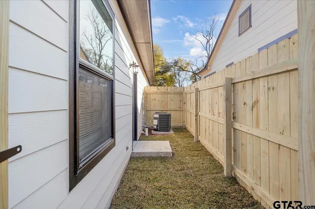 a view of a pathway of a house with a glass door