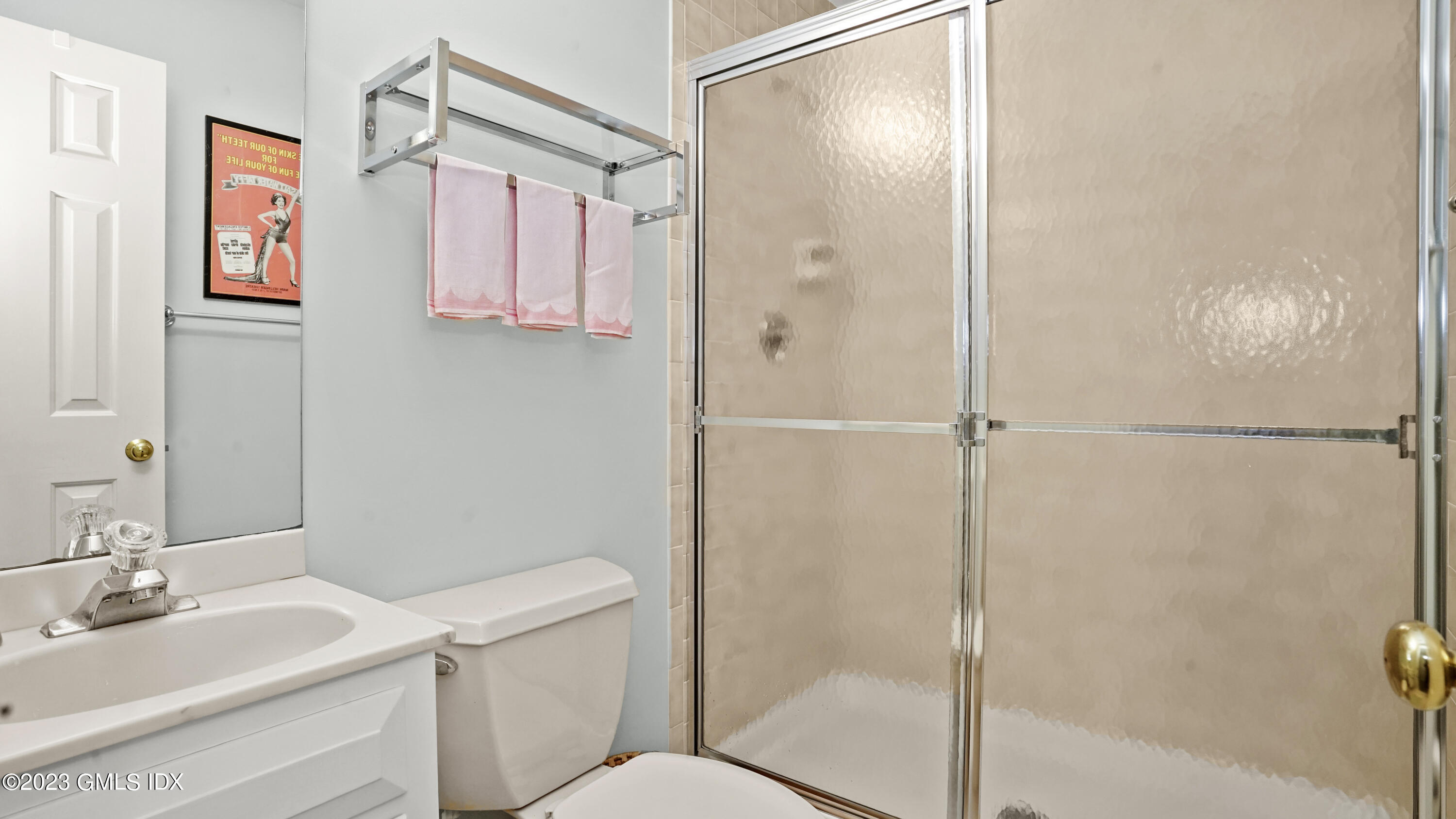 172 Field Point Road, Unit 2 Greenwich, CT 06830 - Photo 13 of 17 a bathroom with a granite countertop sink toilet and shower