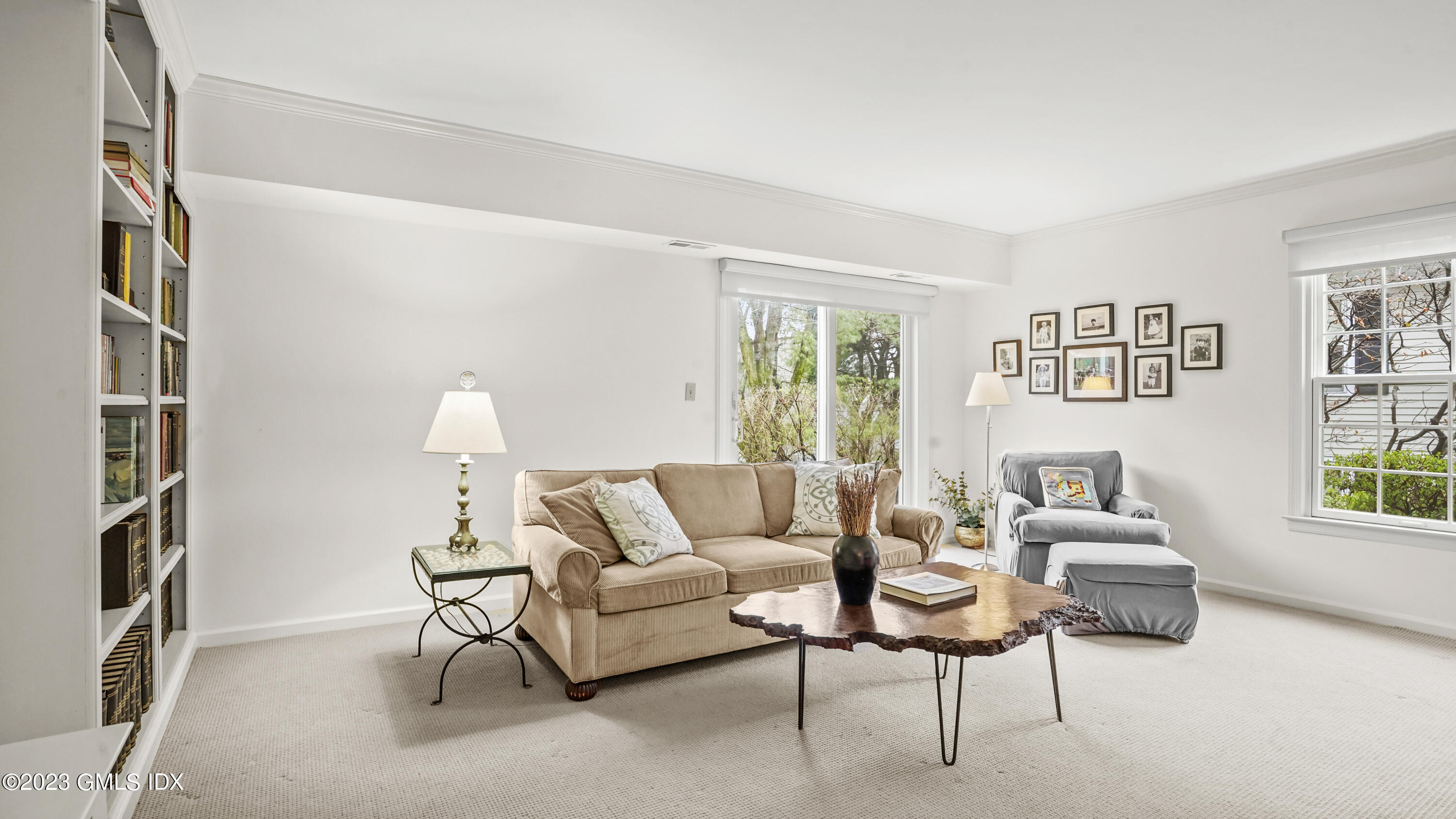 172 Field Point Road, Unit 2 Greenwich, CT 06830 - Photo 14 of 17 a living room with furniture and a window