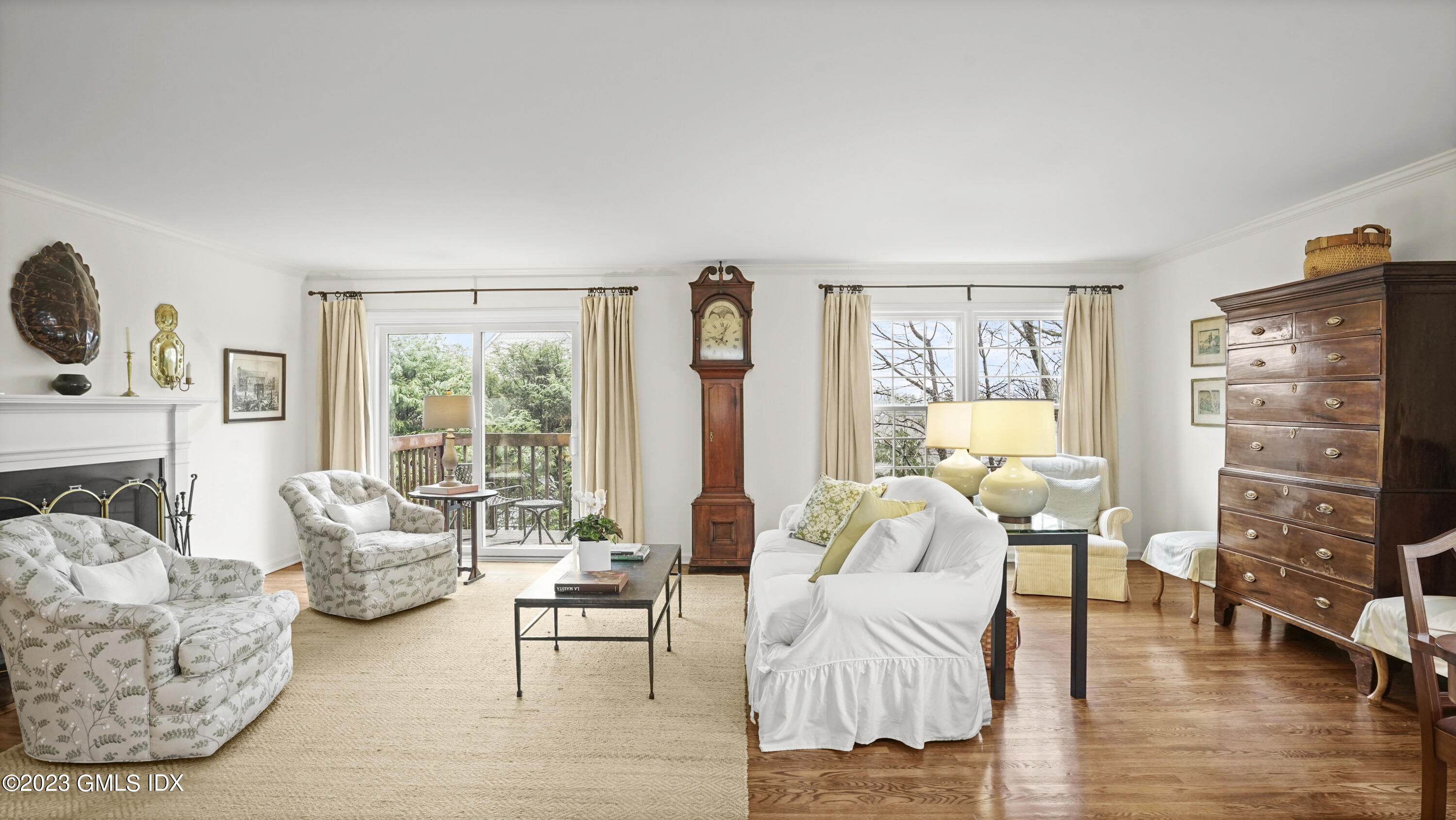 172 Field Point Road, Unit 2 Greenwich, CT 06830 - Photo 5 of 17 a living room with furniture and a large window