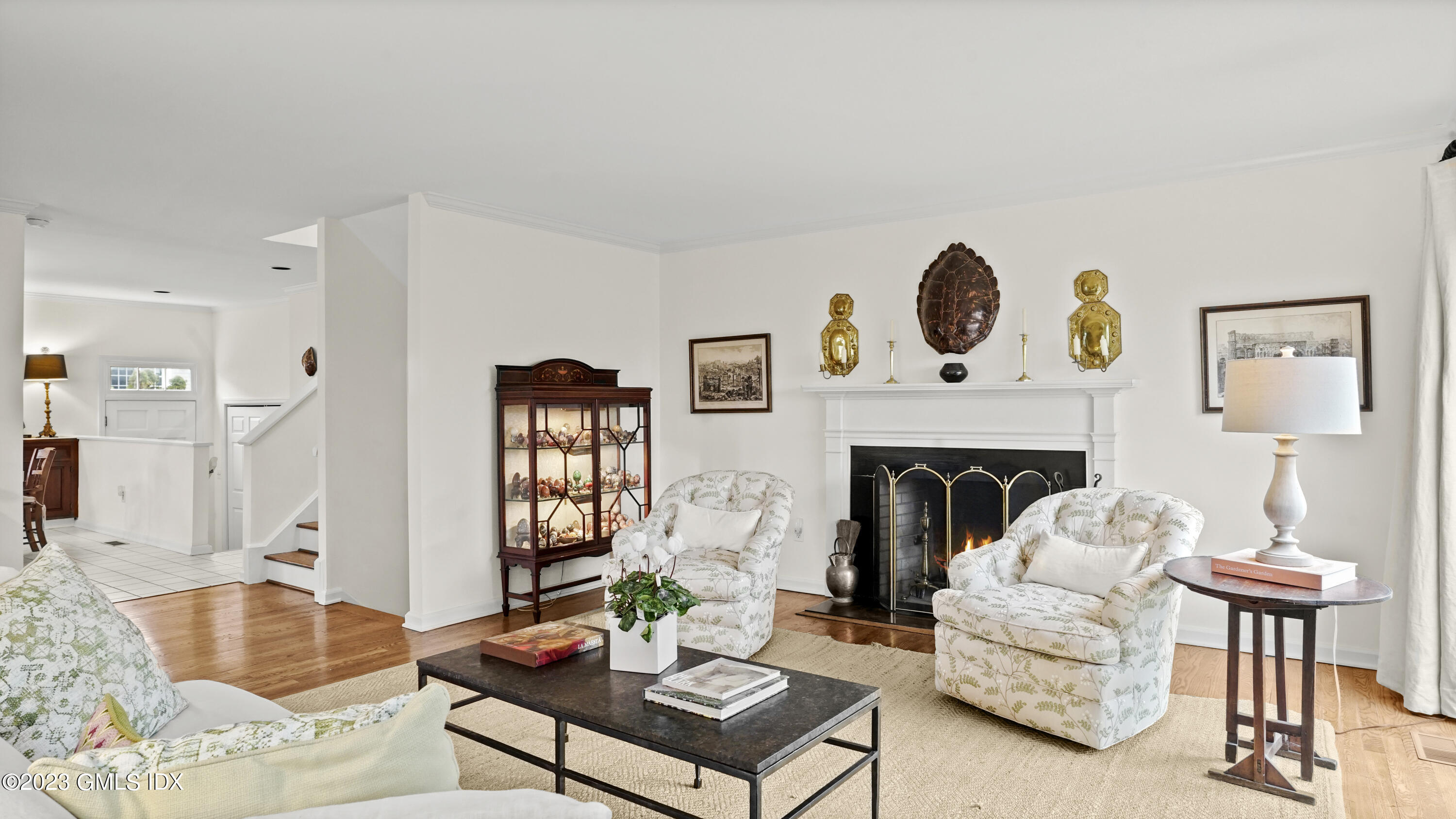 172 Field Point Road, Unit 2 Greenwich, CT 06830 - Photo 6 of 17 a living room with furniture and a fireplace