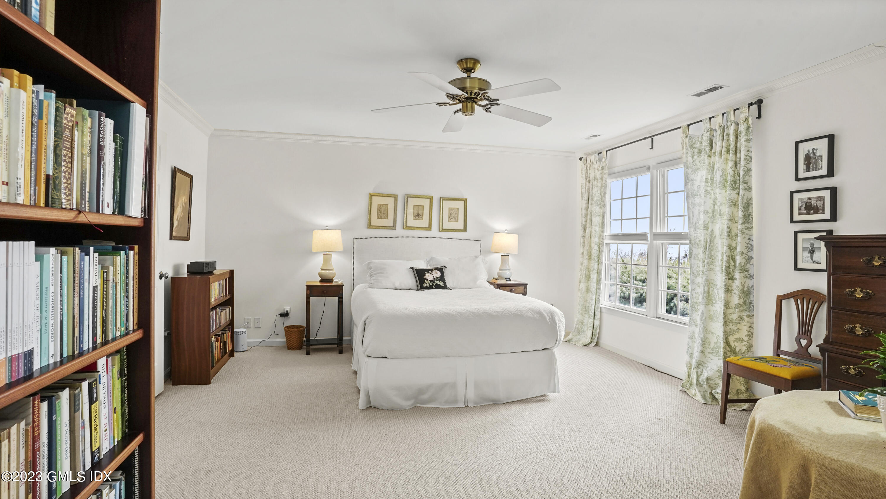 172 Field Point Road, Unit 2 Greenwich, CT 06830 - Photo 9 of 17 a bed room with a bed and a book shelf