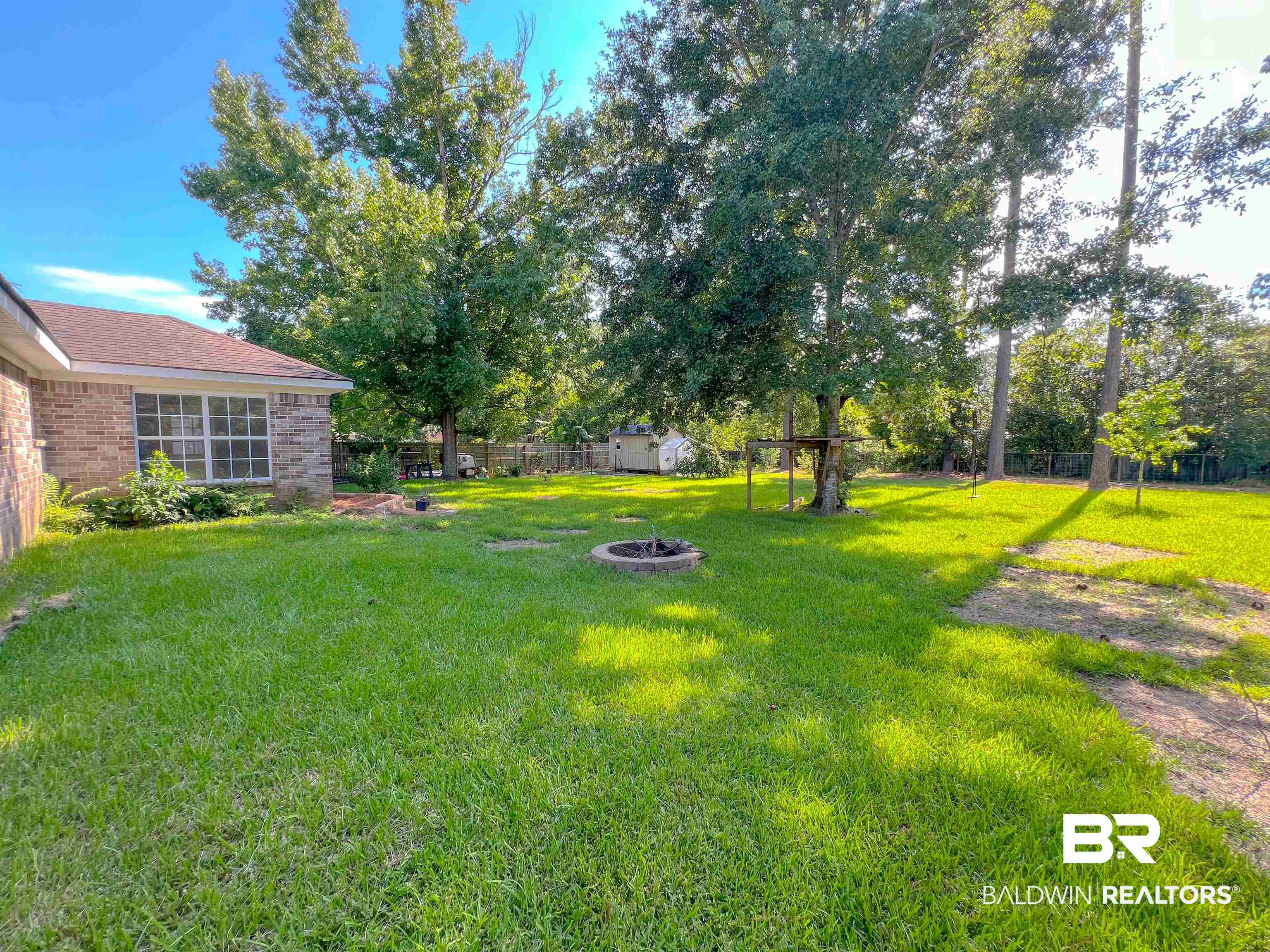 1200 South Juniper Street Foley, AL 36535 - Photo 20 of 23 View of yard with an outdoor fire pit