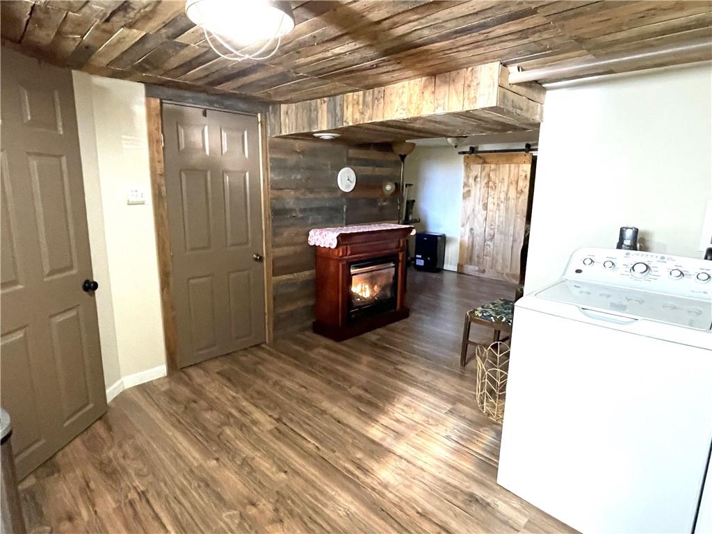 531 Harmony Road Baden, PA 15005 - Photo 21 of 21 Laundry room on right. Gameroom is straight ahead and includes a free-standing gas fireplace.
