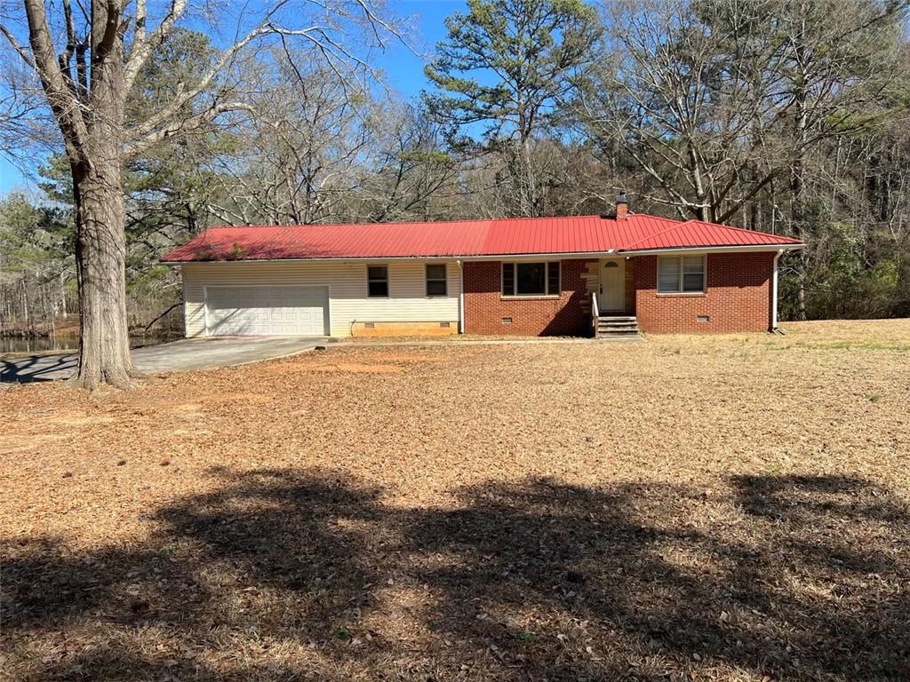 76 Brown Road Stockbridge, GA 30281 - Photo 1 of 1 a view of a house with a yard covered with snow in the yard