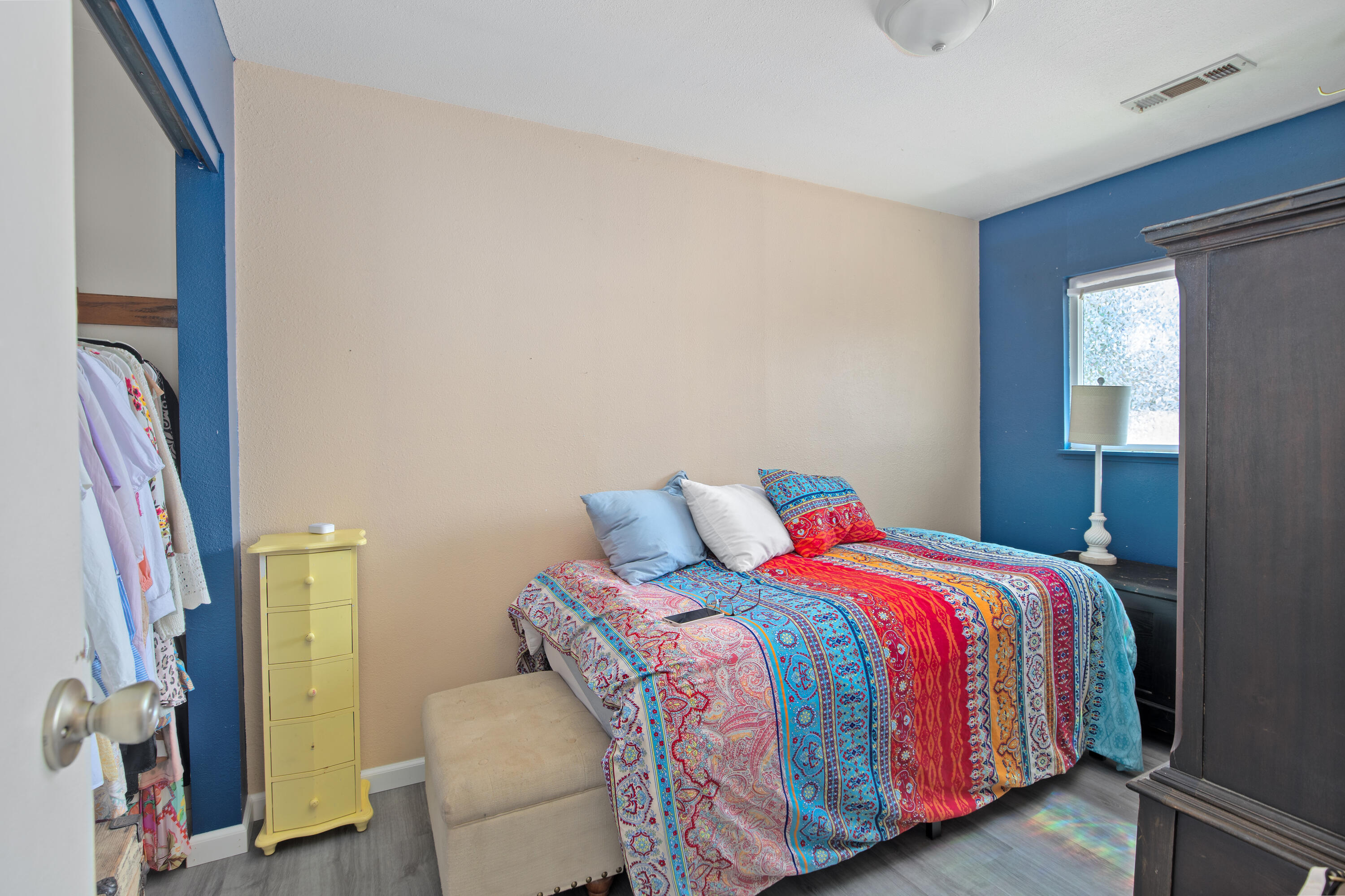 12748 Water Gap Road Williams, OR 97544 - Photo 15 of 35 a bedroom with a bed and a couch