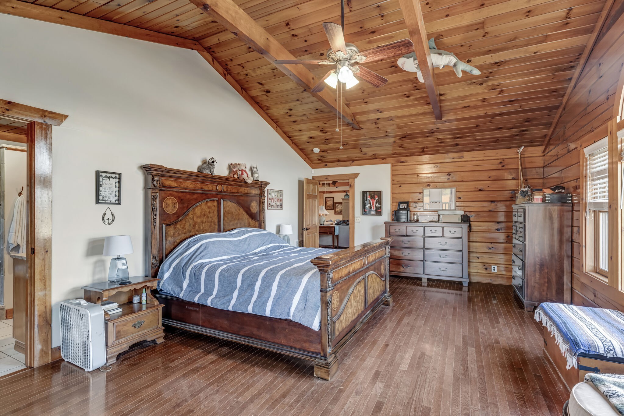 6743 Bethlehem Road Springfield, TN 37172 - Photo 20 of 56 a bedroom with a bed and wooden floor