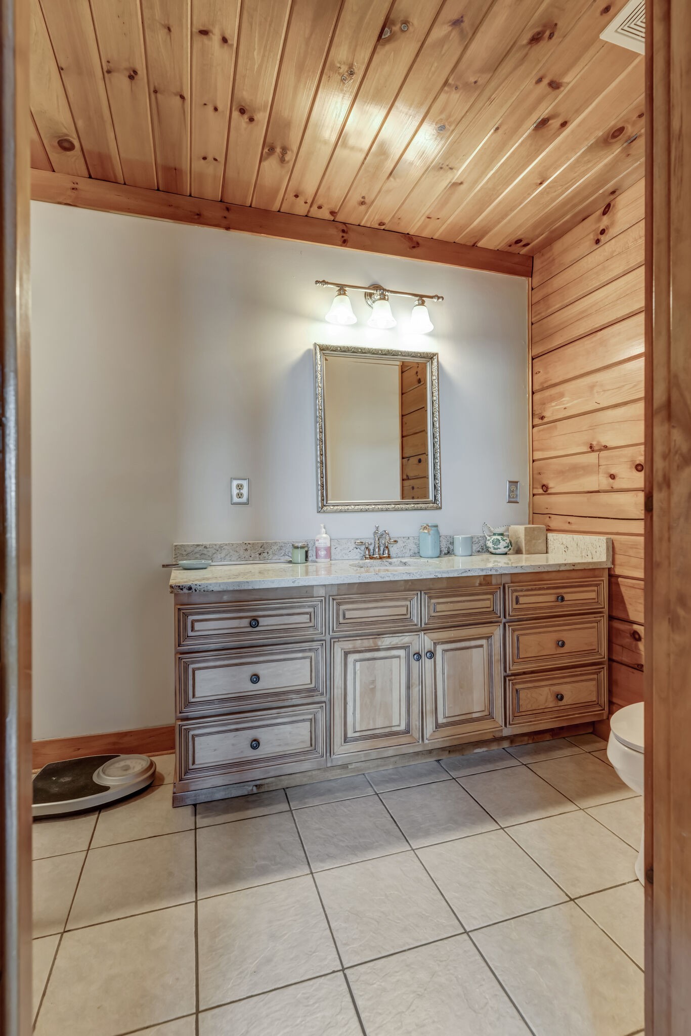6743 Bethlehem Road Springfield, TN 37172 - Photo 27 of 56 a bathroom with a granite countertop sink and a mirror