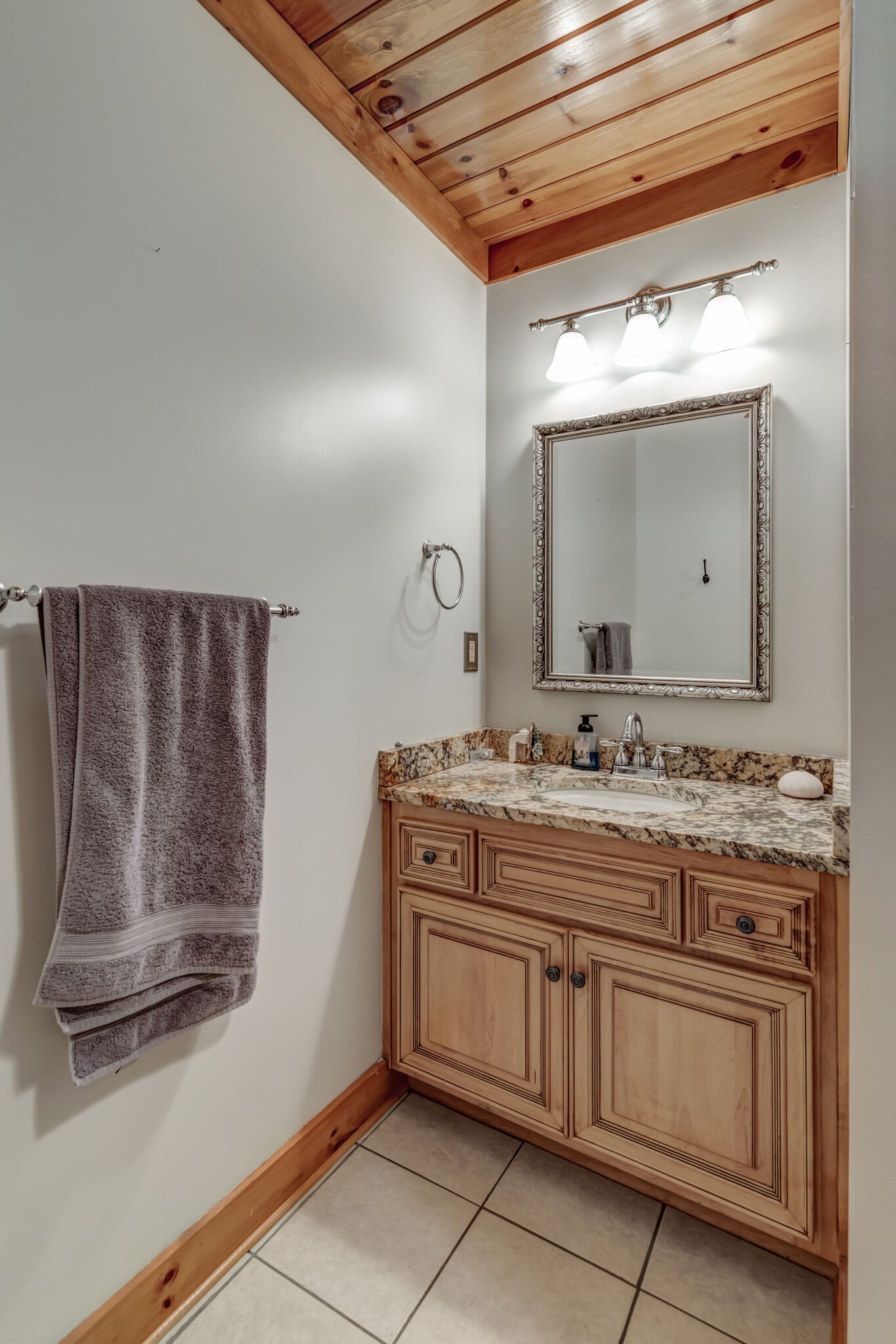 6743 Bethlehem Road Springfield, TN 37172 - Photo 31 of 56 a bathroom with a granite countertop sink a mirror and a