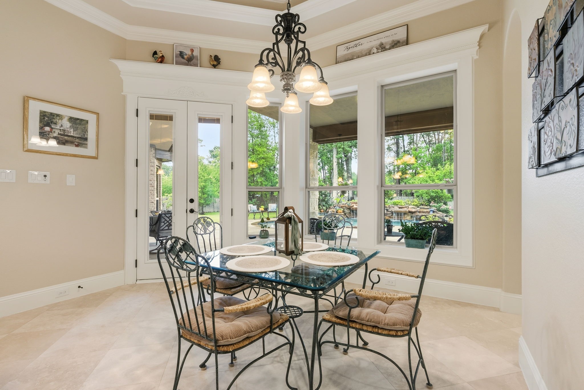 28502 Crawford Ridge Court Huffman, TX 77336 - Photo 22 of 50 a dining room with furniture large windows and a chandelier