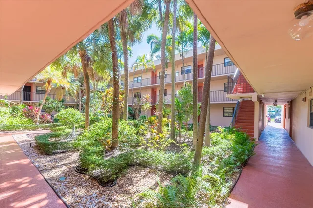 a view of a pathway along the garden