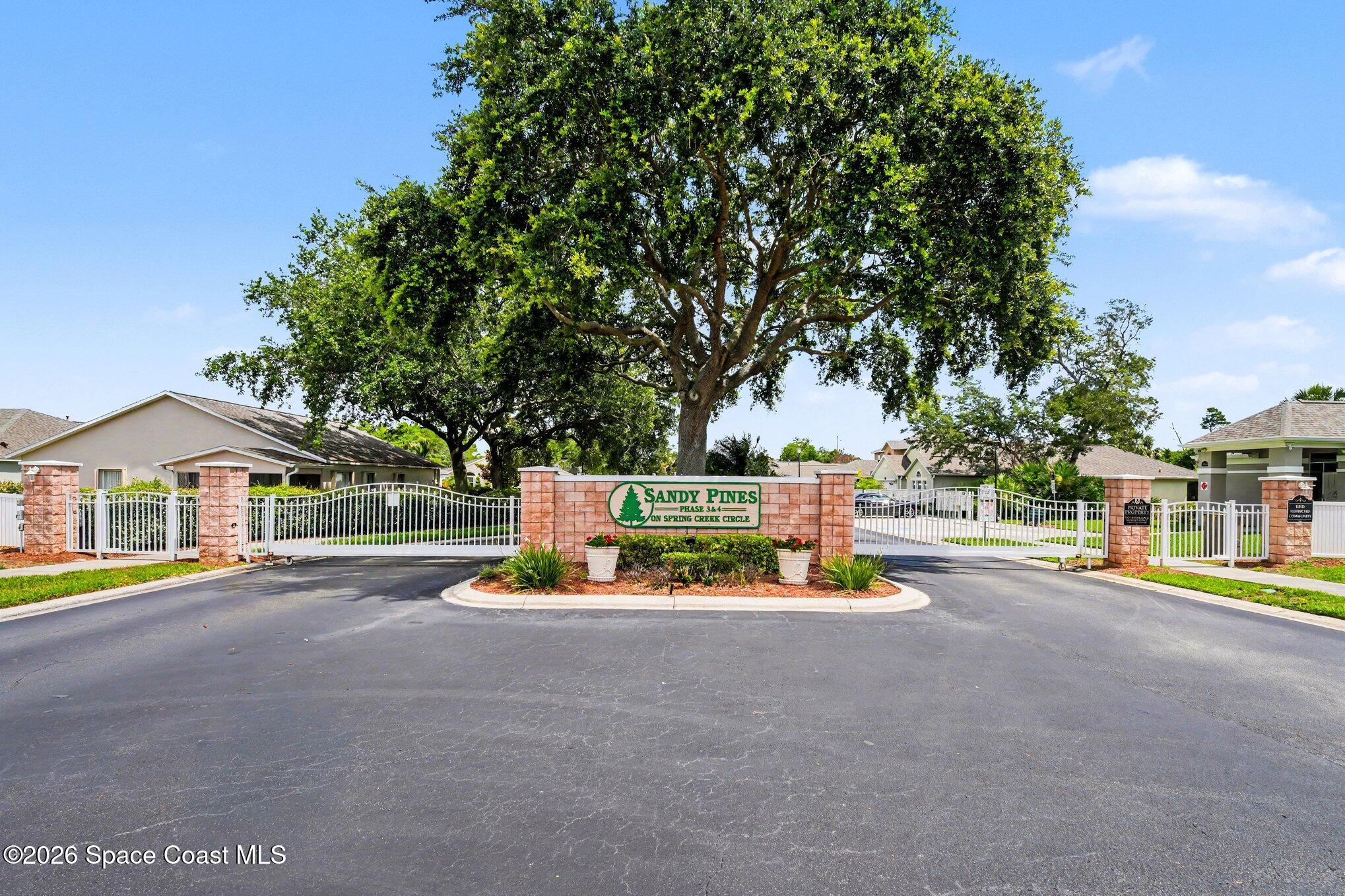 2194 Spring Creek Circle Palm Bay, FL 32905 - Photo 33 of 40 Sandy Pines Entranceway
