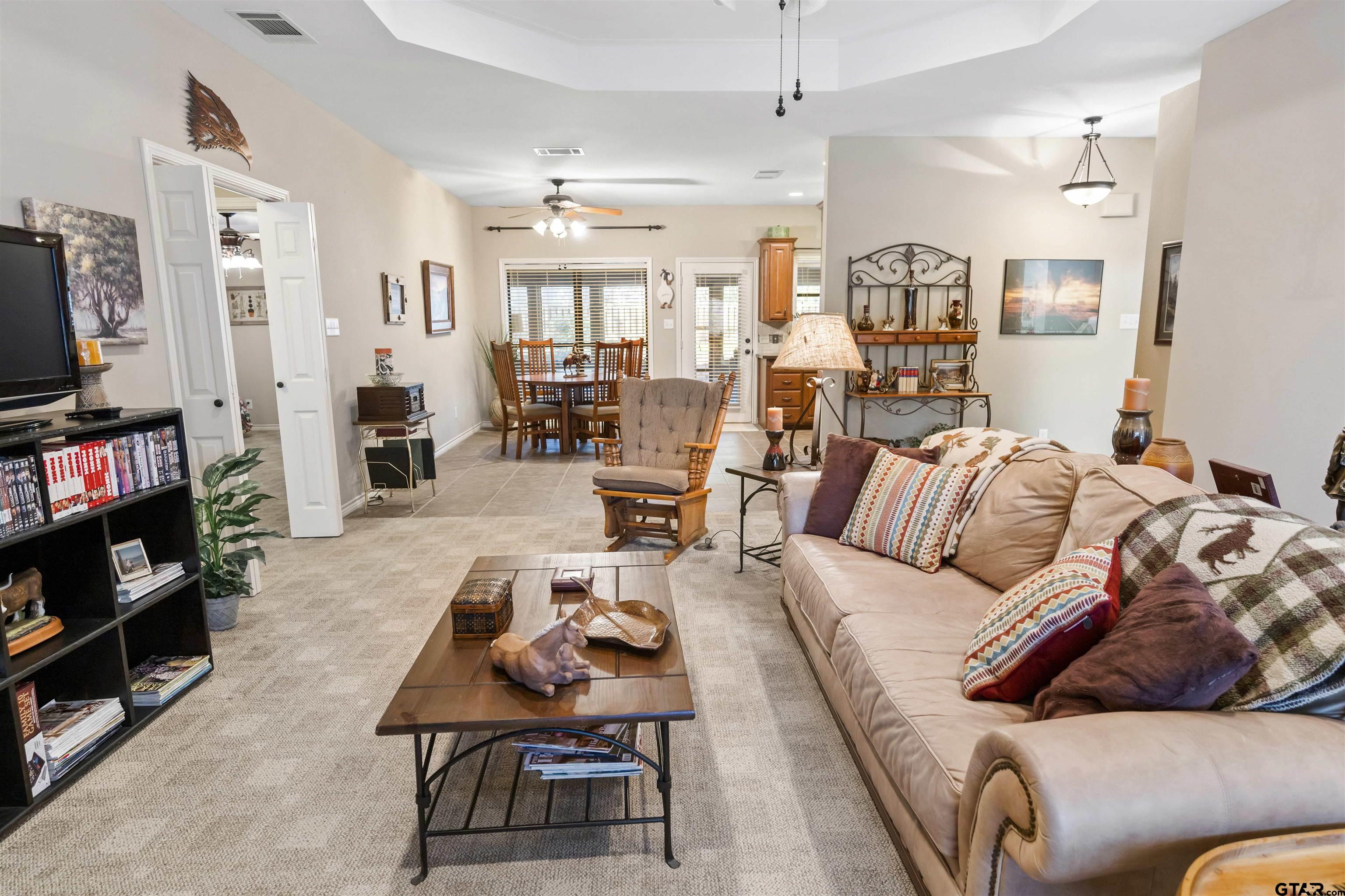 175 Old Gate Path Holly Lake Ranch, TX 75755 - Photo 3 of 28 a living room with furniture and a flat screen tv