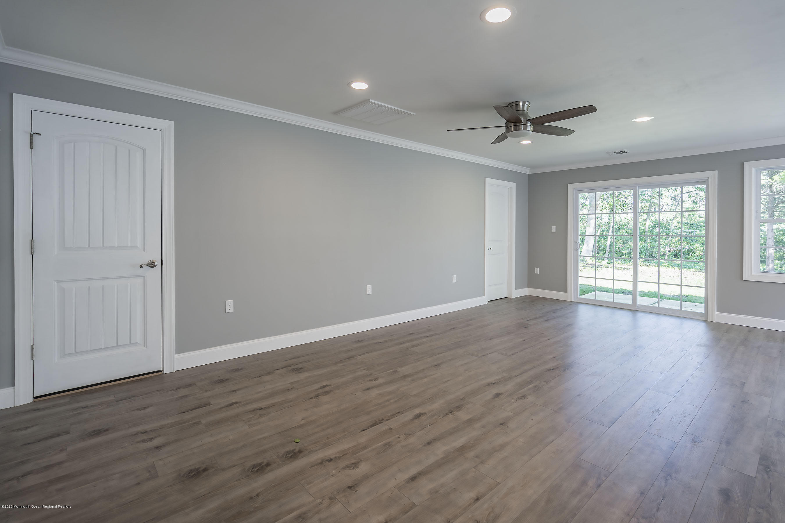 65 Markham Road Brick, NJ 08724 - Photo 13 of 27 a view of an empty room with wooden floor and a window