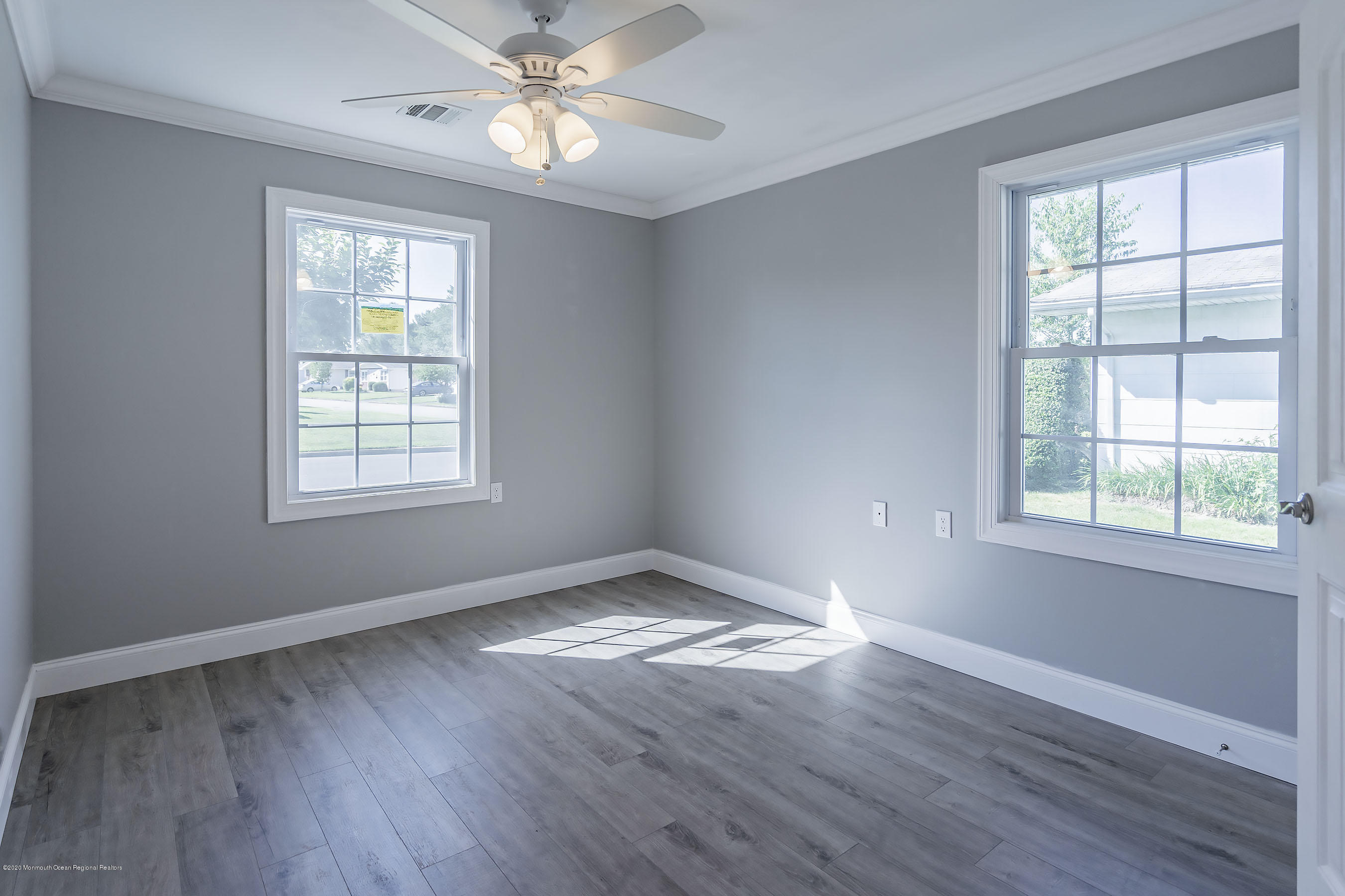 65 Markham Road Brick, NJ 08724 - Photo 17 of 27 a view of an empty room with wooden floor and a window