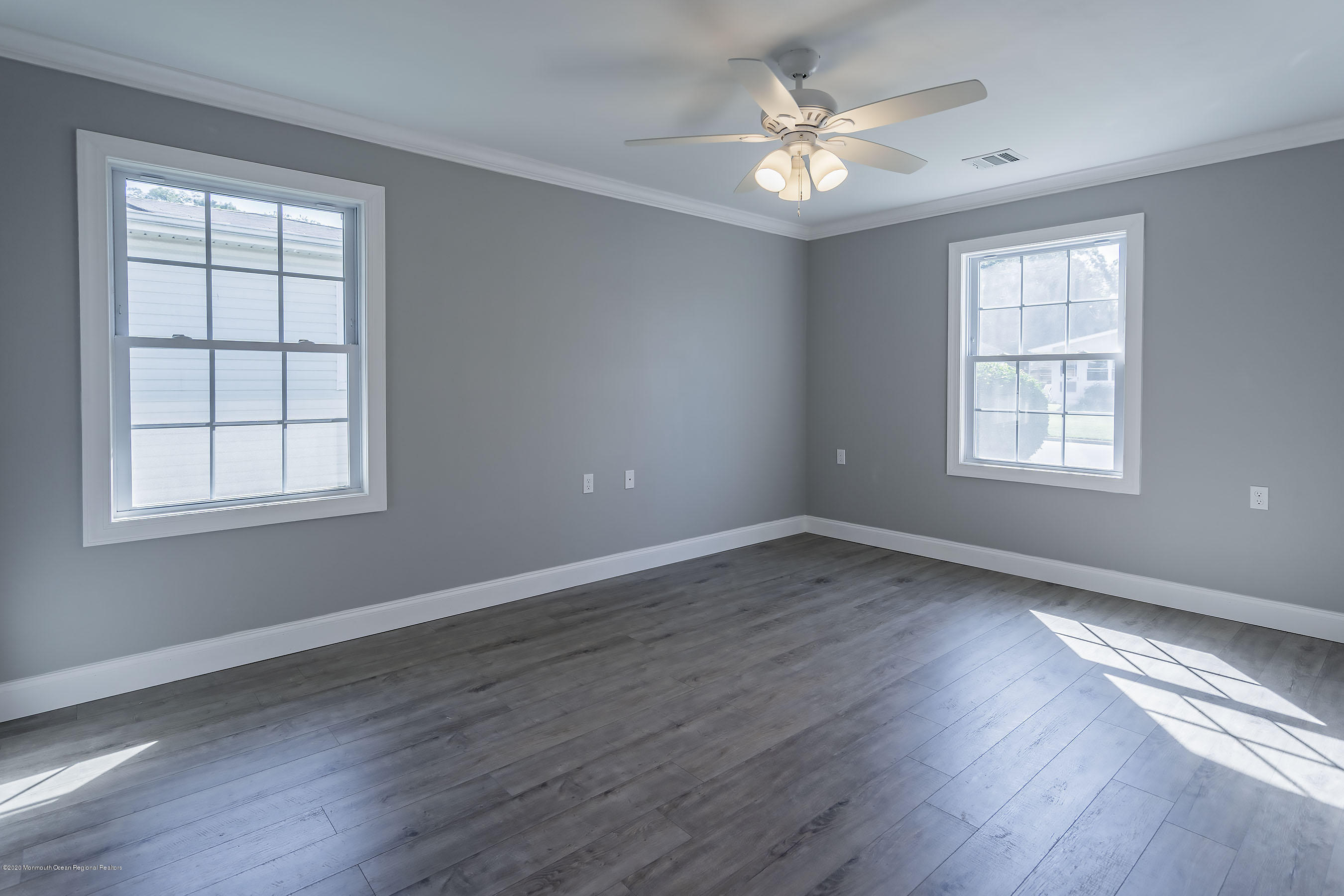 65 Markham Road Brick, NJ 08724 - Photo 20 of 27 a view of an empty room with wooden floor and a window